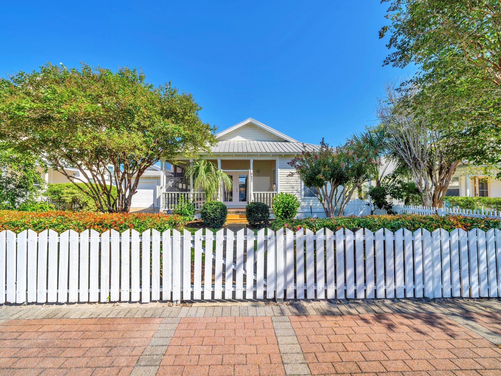 Crystal Shores - just one block from the Gulf of Mexico!! This charming, one-owner Florida cottage has never been rented and offers 3 bedrooms, 2 baths, and a split bedroom floor plan for added privacy. The home features an oversized one-car garage and a large yard, perfect for outdoor entertaining. The backyard includes a pergola, brick patio, outdoor shower, and a spacious wrap-around screened front porch for ultimate relaxation. Located in a short-term rental-friendly community with a low HOA and steps from the community pool, this home is ideal for vacation living, investment, or a primary residence. Just minutes from Destin Commons, restaurants, and vibrant beach life! This beautiful home features tile flooring throughout and has been freshly painted both inside and out, creating a bright and inviting atmosphere. The kitchen boasts granite countertops, and the property includes brand new decking and a freshly painted fence. Offered fully furnished, with a personal item exclusion list, this home is move-in ready and perfect for immediate enjoyment.