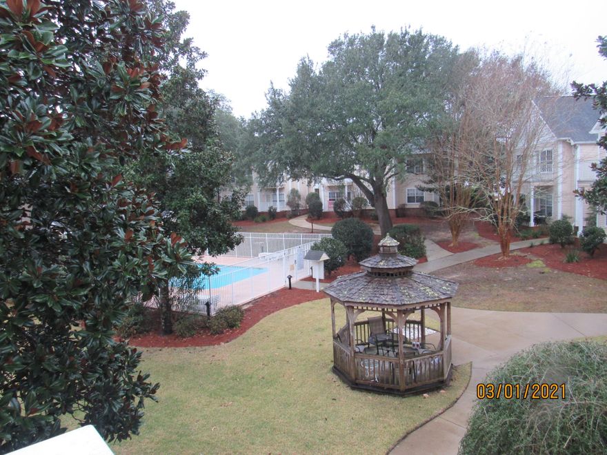 Conveniently located near bases, beaches, schools, shopping, and more, this 2 bedroom, 2 bath condo is well-maintained and close to the community pool, and it features bamboo flooring and neutral paint throughout. The living room is a nice size and leads to a balcony overlooking the pool and gazebo. The full kitchen has a formal dining area. There is a master bedroom with its own en suite and walk-in closet, as well as a guest bedroom and a full guest bath (walk-in shower/no tub).  Stackable washer/dryer included. Cable included in the HOA dues!