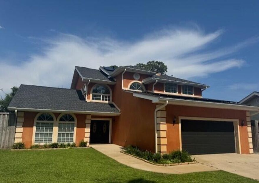 VA ASSUMABLE LOAN available to qualified buyers at 2.5%!  NEW ROOF in 2025 AND PAID OFF SOLAR. Spacious, updated 2548sqft home in a small waterfront community south of 98, with deeded Sound access steps away. Great location, located only 6 miles/10 minutes from both Hurlburt Field and beautiful Navarre Beach and less than a mile to Publix. Grand double entry doors lead to a huge, bright Great Room with a wet bar & French doors to the back deck. The Chefs' Kitchen, features granite counters, a Bosch induction cooktop, stainless appliances, pantry and Breakfast Nook. The adjacent Family room has a cozy gas fireplace and access to the  large heated and cooled Florida Room. Elegant stairs lead up the 2nd floor where the Primary suite offers an updated bath with twin vessel sinks, freestanding tub and tiled walk-in shower. The 2 upstairs guest bedrooms also share a fabulous, updated guest bathroom with a subway tile walk in shower. Don't forget whole home gutters and the large, fully fenced backyard with 8ft privacy fences; plus irrigation, a shed, firepit, a fruit bearing Pear tree and double gate access to park your RV, Boat or other toys! Other special interior mentions include new paint, new light fixtures and ceiling fans, a water filtration system, oversized 2 car garage with new garage door and many new smart home accessories such as Nest Thermostats, a video doorbell,  front door keypad, garage opener and more!  This exceptional home is ready and waiting for it's new owners. Home is located in Flood Zone X and flood insurance, whilst highly recommended, is not required!