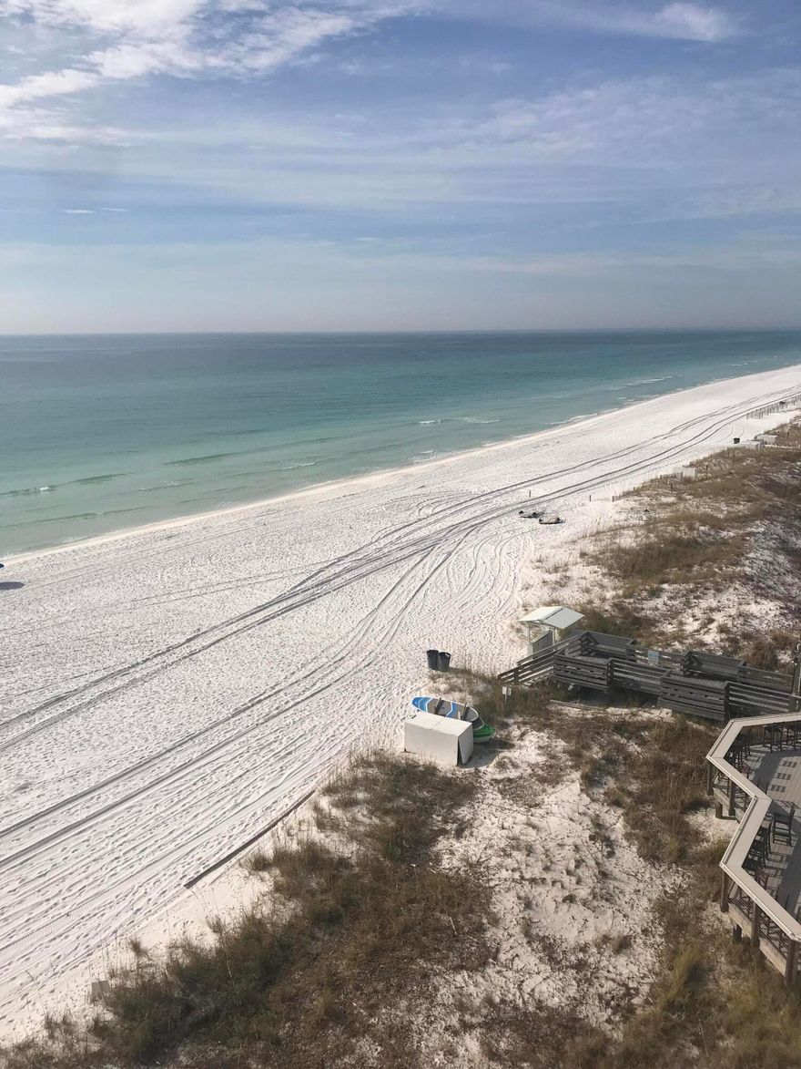 Searching for a fantastic condo in Destin? This is exactly what you're looking for: a direct and up close view of the beach, with nothing between you and the emerald waters and white sands.  This Destin Gulfgate condo features an enormous, 30 ft. balcony opening onto 450 feet of private beach.  The family room and master bedroom both have floor to ceiling glass doors to the balcony and those stunning Gulf views.  It is nearly twice the size of the typical Destin condo, with large rooms and a full size kitchen.  The kitchen includes stainless steel appliances, granite counter-tops, and soft close cabinets.  There is a wine bar, an ice maker, plenty of storage and a rare and coveted deeded GARAGE parking space.  That great balcony includes hurricane shutters.  And there's a bonus item...