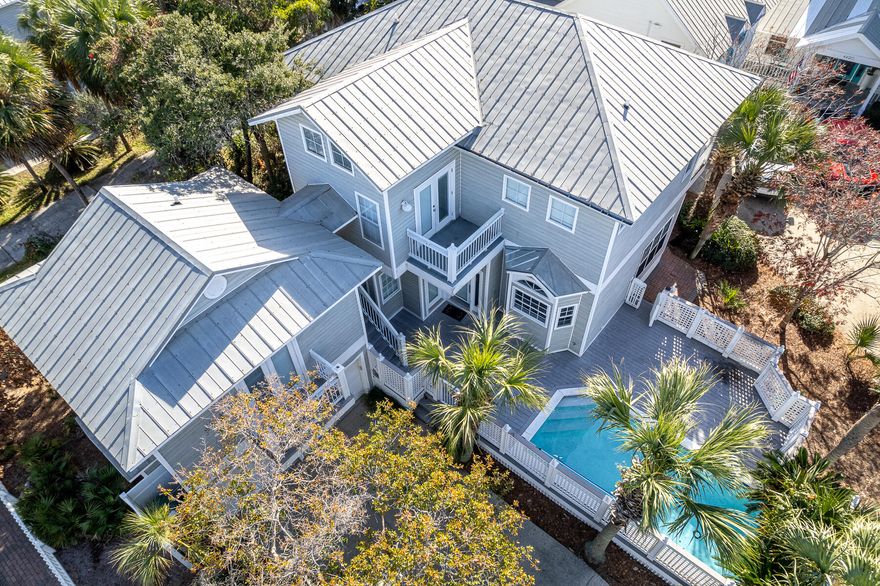 This property is currently under contract with an inspection contingency and a 72 hour kick-out clause. Discover the allure of coastal living in this home, conveniently located within close proximity to the beach. With 5 generously sized bedrooms & 5 well-designed bathrooms, this residence is perfectly suited for a primary, secondary, or investment property. The first floor welcomes you with an open living room. Overlooking the private heated pool, the dining area & fully equipped kitchen provide both functionality & aesthetic appeal. The master bedroom suite, situated on the first floor, opens onto a private patio, offering a serene retreat. The master bathroom indulges with a whirlpool tub and a walk-in shower. Venturing to the second floor,  you'll find additional living space, along with 3 additional bedrooms. Above the private two-car garage, a carriage house awaits, complete with a living room, a kitchenette, and a bedroom.

Crystal Shores amenities, including access to the community pool, add to the appeal of this property. Positioned as a wise investment, the home's prime location and desirable features ensure enduring value and a solid return. Enjoy close proximity to delightful restaurants, excellent shopping centers, championship golf courses, and a short walk to the sugar-white shoreline of the Gulf of Mexico. Seize the opportunity to own this charming home, perfectly nestled in one of Florida's sought-after areas.
