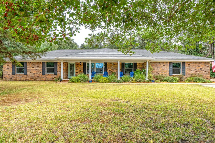 Rare find in Bluewater Bay! Beautiful all brick home has been updated throughout and features an open floor plan within a great neighborhood & plenty of privacy sitting on over an acre of land. This 4 bed 2.5 bath home boasts granite countertops, custom kitchen cabinets and pantry for plenty of storage, and stainless steel appliances w/gas stove. Main living area features wood-look tile throughout and a gas fireplace surrounded by custom built-ins. Home also has impact rated, low-e argon windows which are good for hurricane protection as well as heating/cooling efficiency. The metal roof w/wood shake design has a 50-year transferable warranty from date of installation, giving new buyers long-term coverage. Home also comes with a transferable termite bond. Additionally, this home has a very spacious side entry 2-car garage with work bench and a long, partially circular driveway to accommodate multiple cars. Home also includes a 24.3 ft x 10.7 ft shed that can be used as a workshop (w/ power & wall unit a/c) & 2 other storage sheds for garden tools and lawn equipment. The back yard is fully fenced with a separate fenced-in dog run to give your pets plenty of running room without having them in the back yard.  It also has a well with yard pump to supply the programmable sprinkler system.  The backyard is a true haven with plenty of quiet privacy and wooded areas.  You are also never far from the white sandy beaches of the Emerald Coast as the bridge access road is just off White Point Rd. Call for your appointment today and scoop up this immaculate home!