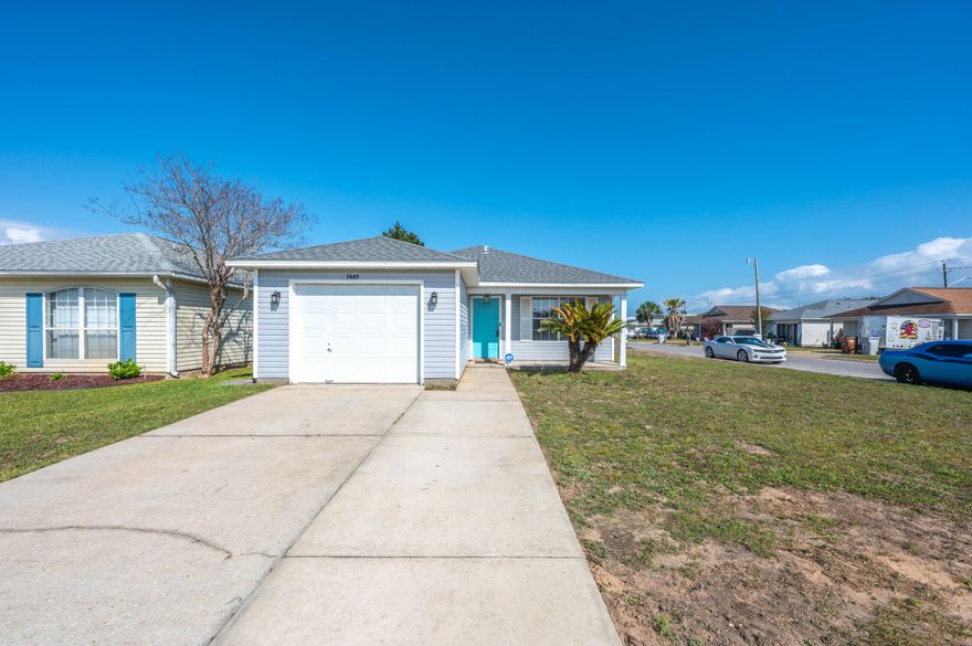 Situated on a corner lot, this lot offers tons of blank-slate potential, just bring your green thumb. The spacious and open great room is ready for you to entertain, with neutral white cabinetry and a bumped-up breakfast bar. Beautiful bamboo flooring has recently been installed throughout the main living area and bedrooms. The primary bedroom is situated near the rear of the home, and it boasts an en-suite bathroom complete with shower-tub combo (with a generous soaker tub) and vanity. You'll enjoy the covered front porch as much as the open and roomy backyard. Conveniently located a mere 4 miles to Navarre Beaches. Check out our full video tour on MLS and YouTube.