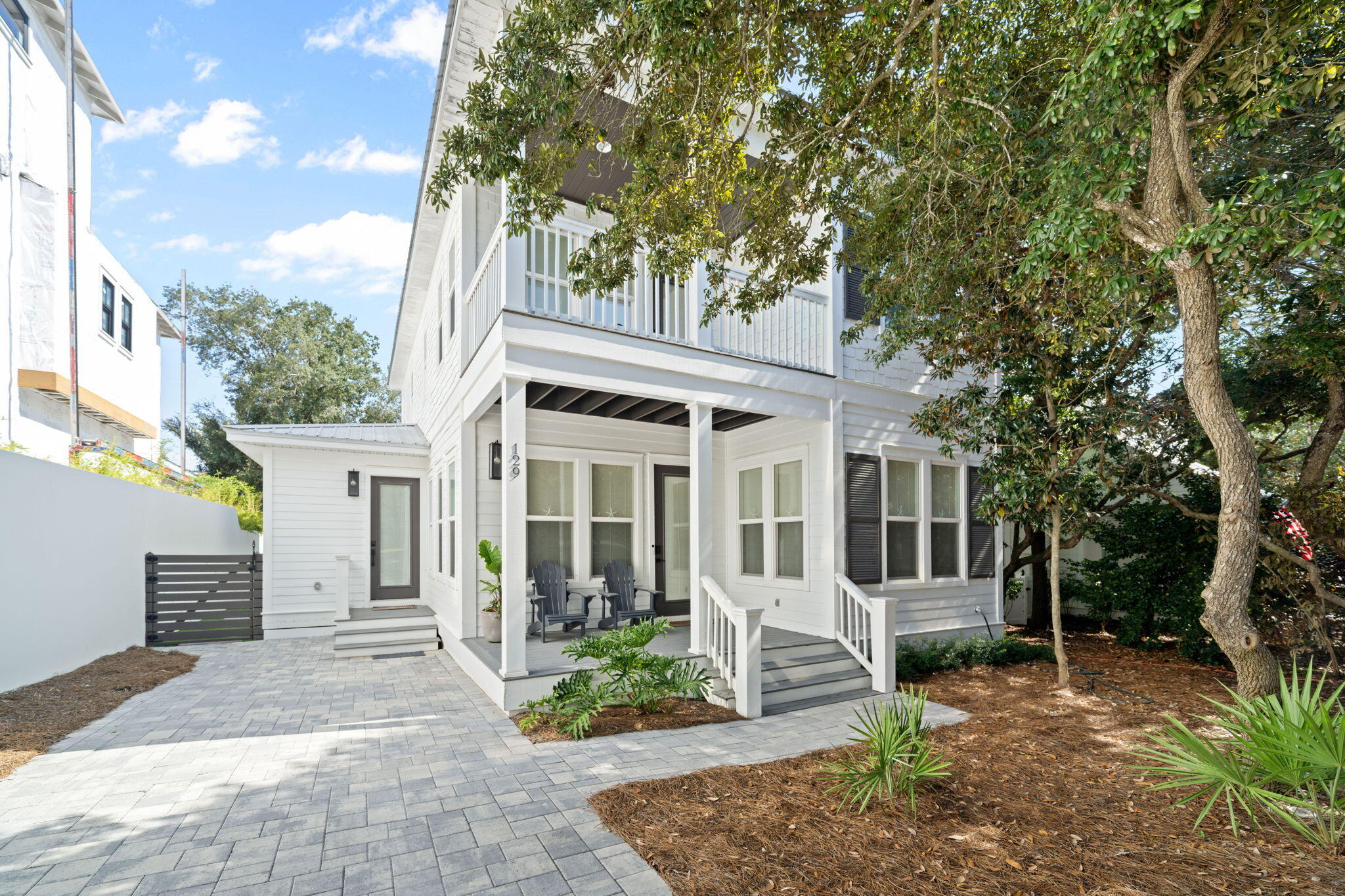 Completely remodeled in 2022, this beautifully updated beach home is just one block from the gulf and embodies the relaxed yet vibrant 30A lifestyle. Spend your days biking, strolling, shopping local boutiques, dining at neighborhood restaurants, or soaking up the sun on the beach--then return to your own private retreat complete with a sparkling pool and elegant interiors. Inside, the heart of the home is the open-concept kitchen, dining, and gathering area. A striking quartzite and stone island pairs seamlessly with high-end Dacor stainless steel appliances, setting the stage for effortless entertaining. The newly added mudroom, equipped with washer and dryer, makes coming home from the beach a breeze. Durable light-toned luxury vinyl plank flooring flows throughout the first floor, while soft carpeting enhances the comfort of the second story. A dedicated bunk room ensures plenty of sleeping space for kids and guests, plus having a master bedroom on both floors makes this home ideal for families or rental potential. Outdoor living was designed with both relaxation and entertaining in mind. A screened-in porch features a full outdoor kitchen, while the backyard offers a grill station and a completely resurfaced pool with new gunite, coping, heater, and equipment. Additional improvements include a new driveway and back patio. Whether you're seeking a full-time residence, vacation getaway, or investment property, this Old Seagrove gem delivers the best of coastal living just steps from the Gulf.