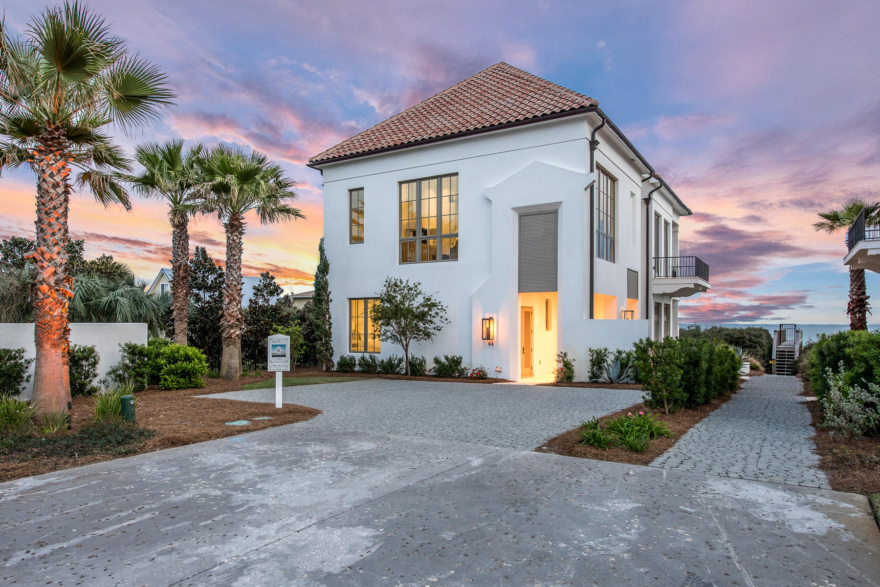 Exquisite beach front home in exclusive E-scape community of Inlet Beach. The private gated 4 home community of Escape holds only Gulf front homes of exceptional quality. Built with fortified construction and highest energy efficiency standards, and designed by A Boheme Design of Rosemary Beach, this waterfront home is comprised of only top-of-the-line materials and finishes. Subzero and Wolf appliances fill the chef's kitchen, and you'll find all stone tile and brushed wood flooring throughout. The unsurpassed views of the Gulf can be enjoyed from each of the homes 3 levels. The 3rd level exclusively holds the master suite, oversized master bath and closet, and a private balcony. The 2nd level holds the home's kitchen, living area, an additional bedroom,