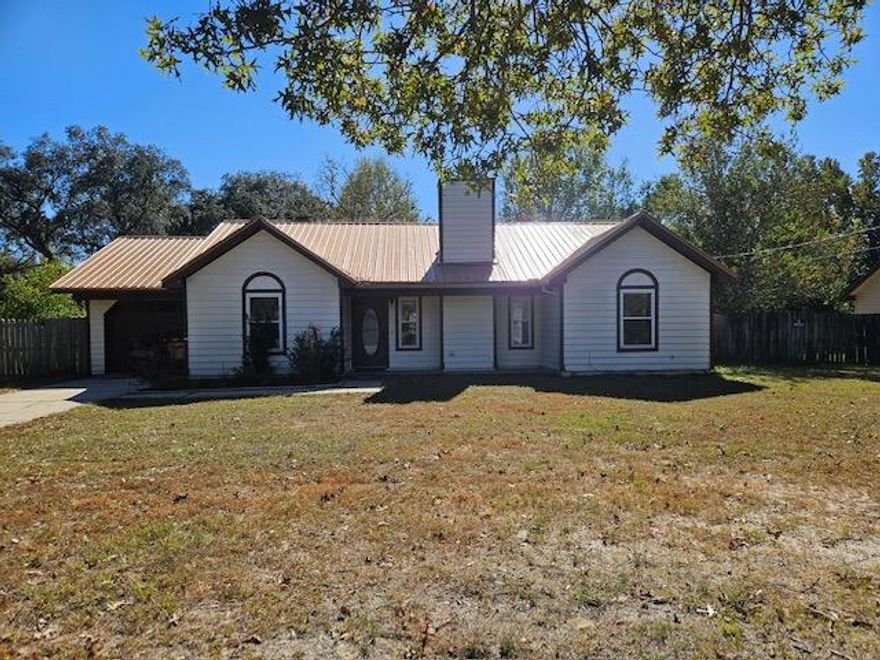 South of I-10.  This lovely split floor plan has a large living area with a wood burning fireplace. New LVP in kitchen, bath, utility area, and bedrooms.  The kitchen has plenty of cabinets for storage. Large utility room with pantry. Master bedroom has a large walk in closet with plenty of room for your oversized furniture. Great size back yard for the kids to play.