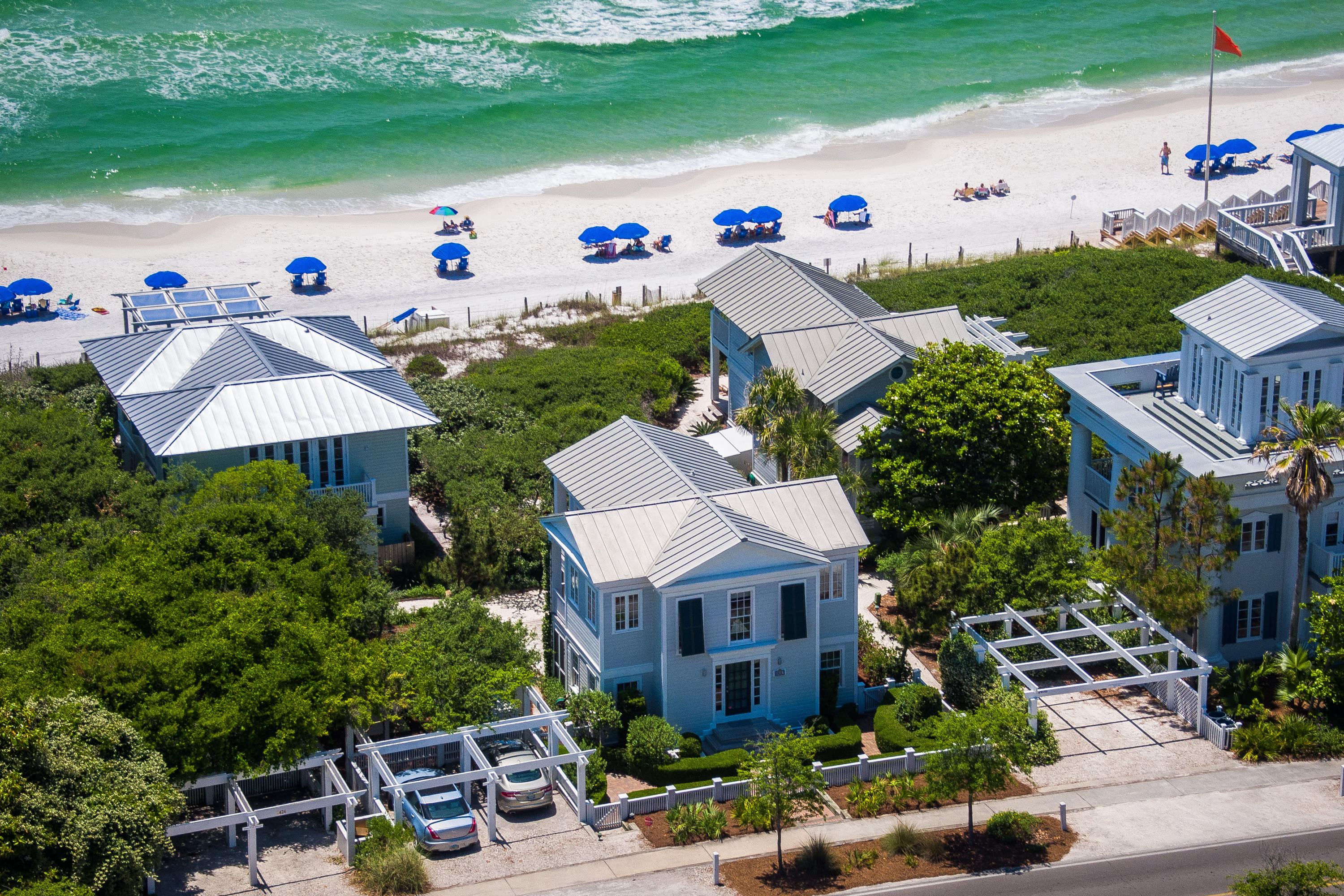 Charming Seaside Cottage!!! This truly one of a kind home is one of Seaside's original beach cottages. Designed by Scott Merrill and built by Benoit Laurent this home offers unobstructed gulf views and easy beach access! The first floor offers 3 bedrooms and 2 full baths with lots of private porch space. Each bedroom has its own screened porch! The second floor features an open living, dining, kitchen area with beautiful gulf views. There is a screened porch off both the kitchen and dining room and a large screened porch off of the living room! This allows for spectacular views of the beautiful beach and Gulf of Mexico! This property has lush landscaping and a 2 car carport.