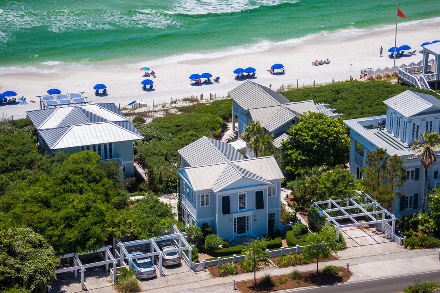 Charming Seaside Cottage!!! This truly one of a kind home is one of Seaside's original beach cottages. Designed by Scott Merrill and built by Benoit Laurent this home offers unobstructed gulf views and easy beach access! The first floor offers 3 bedrooms and 2 full baths with lots of private porch space. Each bedroom has its own screened porch! The second floor features an open living, dining, kitchen area with beautiful gulf views. There is a screened porch off both the kitchen and dining room and a large screened porch off of the living room! This allows for spectacular views of the beautiful beach and Gulf of Mexico! This property has lush landscaping and a 2 car carport.
