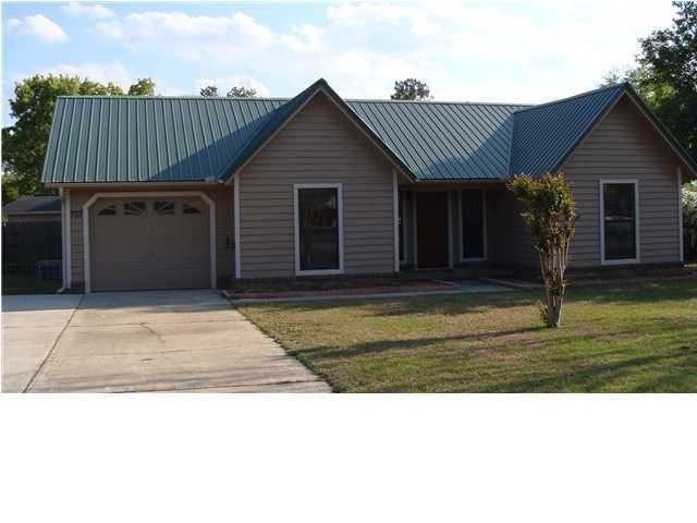 **KITCHEN IS FINISHED AND BEAUTIFUL. Call to see the professionally installed Silestone Quartz kitchen countertops, tile backsplash, under mount sink and updated faucet.** Beautiful home on the South end of Crestview. This 3 bedroom 2 bathroom home has been carefully updated and maintained. The house is situated on a large level lot with a fenced back yard, yard building, and beautiful pool. The house features a split floor plan with a huge screened porch and media room. The welcoming family room includes vaulted ceilings and a wood burning fireplace. The dining area is the perfect size for family meals. The kitchen has been updated with a large pantry. Although the sellers decided not to install a new dishwasher, the space is available for one with electrical and plumbing. The