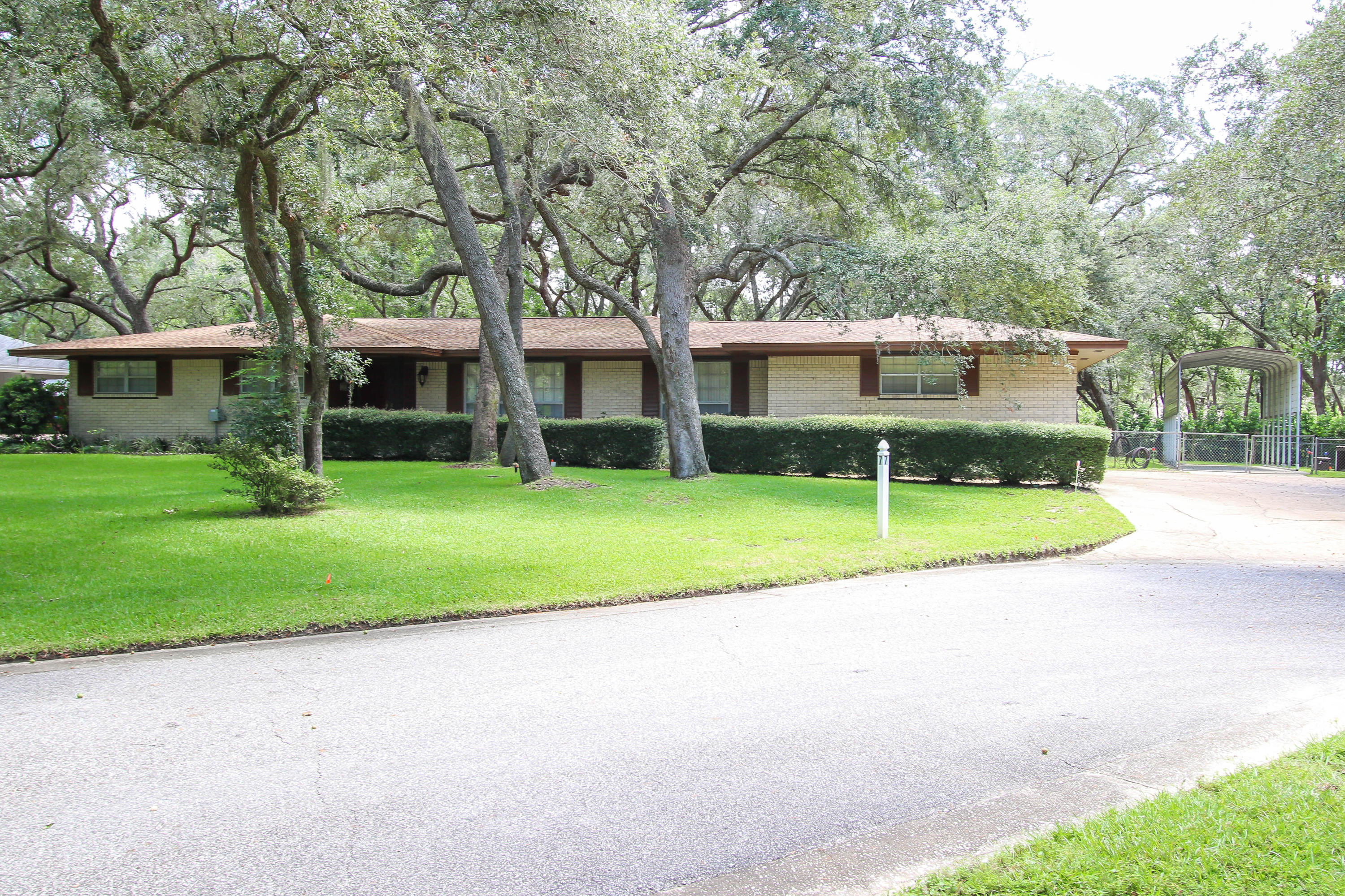 Freshly painted exterior earlier this year, new lawn pump 2016, new roof 2013 and NEW copper wiring 2012. Located in the desirable Kenwood neighborhood! A half acre lot, mature live oaks, and a cul-de-sac with interior landscaping define the picturesque setting for this one-owner home. Meticulously maintained inside and out, a few interior updates would make this property a real showpiece! The large kitchen space overlooks an eat-in area and lush backyard through a 12 ft bay window. The 4 bedrooms are generously sized and the Master has walk-out access to the 400 sq ft backyard terrace with unobstructed views of neighboring trees. Have a boat or RV? A covered parking pad is conveniently situated adjacent to the driveway along with a large storage shed.