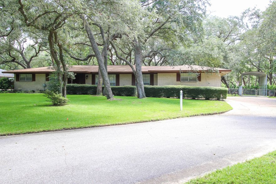 Freshly painted exterior earlier this year, new lawn pump 2016, new roof 2013 and NEW copper wiring 2012. Located in the desirable Kenwood neighborhood! A half acre lot, mature live oaks, and a cul-de-sac with interior landscaping define the picturesque setting for this one-owner home. Meticulously maintained inside and out, a few interior updates would make this property a real showpiece! The large kitchen space overlooks an eat-in area and lush backyard through a 12 ft bay window. The 4 bedrooms are generously sized and the Master has walk-out access to the 400 sq ft backyard terrace with unobstructed views of neighboring trees. Have a boat or RV? A covered parking pad is conveniently situated adjacent to the driveway along with a large storage shed.