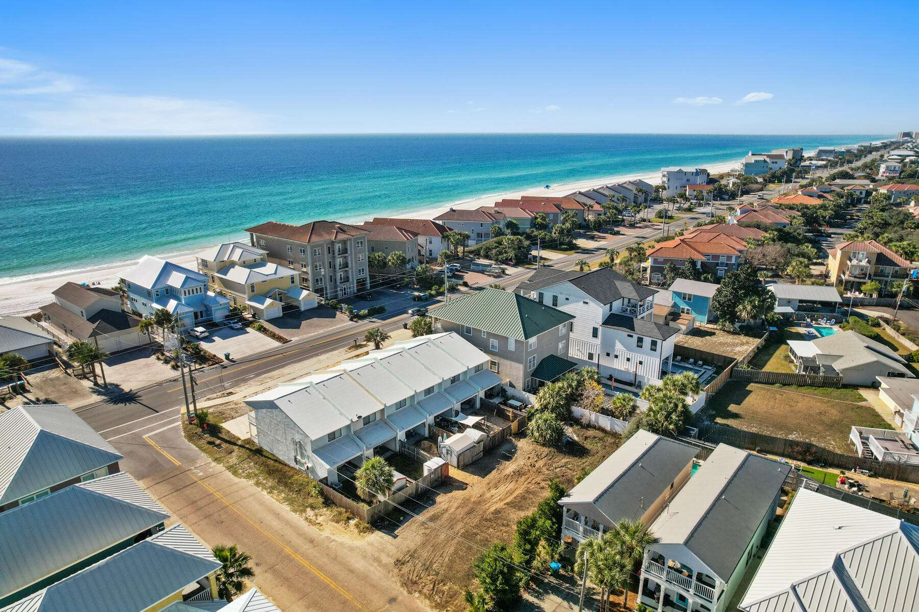 Start the new year with a bang! This ocean-view lot in Panama City Beach's Riviera Beach neighborhood offers a rare chance to own property with two stunning water views. Build a 4-story dream home or investment property, up to 45 feet high, with panoramic views of the Gulf of Mexico and Riviera Lake. The 100x50 lot is steps from the beach and offers breathtaking sunsets from your upper floors. Perfect for a vacation rental or coastal home. With building setbacks of 20ft in the front, 5ft on each side, and 10ft in the back, this lot offers endless possibilities in a sought-after location. Don't miss out!