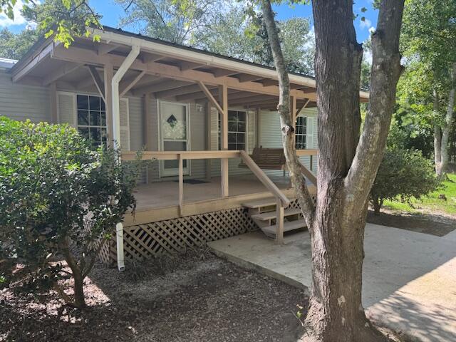Are you looking for peace and tranquility? This property has it! It is set back from the road and partially surrounded by woods, pleasantly secluded. This fully renovated mobile home provides you with plenty of space for your living needs. Wood-grain vinyl planks throughout the home, with tile in the laundry area and bathrooms. New metal roof 2024 as well as recent HVAC 2024 and water heater 2020. Kitchen cabinets, countertops, and appliances have also been recently updated. Outside provides you with a two-car carport, a workshop, and a storage shed as well as a newly placed gravel driveway. You can watch the sunrise on your front porch and watch the sunset on your back porch! Chained link fence encloses the .258 acre property. Don't let this one slip pass you! Call for a showing today!