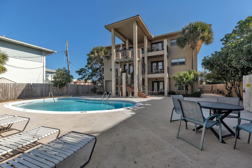 Looking to buy your next vacation home that makes you money while you're away?! This condo is a turnkey short-term rental, just a 2min walk to the stunning Gulf of Mexico! It is VA approved with only 6 units in the association. Stainless steel appliances and crown molding throughout. The washer and dryer convey. All furniture, linens, and amenities, minus a few personal items, will convey. French doors lead to your patio, where you can enjoy tranquil views overlooking the sparkling pool. Island Palms Condos allows you to self-manage, primed to bring in top dollar as a sought-after vacation rental. The new owners can enjoy 2 beach chairs and 1 umbrella for free through October 2025. Don't miss this opportunity to own a slice of paradise that pays for itself. Schedule your viewing today!