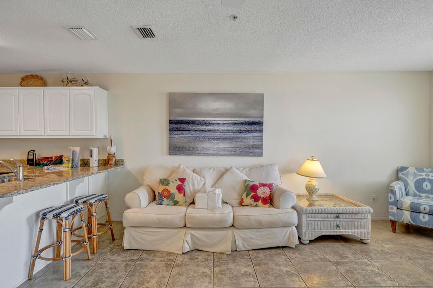 This adorable unit has BOTH views from the balcony...Sound and Gulf!  Like new with granite kitchen counter tops and undermounted stainless steel sink and stainless steel appliances.  Very tastefully decorated!  All window treatments convey with sale.  Furnished with exception of a few exclusions.(List provided in Document section.)  Fire sprinkler systems are in place in all units.This 1 Bedroom with hallway bunks and a pull out sofa (accommodates 6) could be a rental investment, second home or permanent residence.  Beach access is right across the street. Rental income in 2021 was 33,900 Gross.  Projection is higher for 2022.  Community has a nice pool with showers and restrooms.  Don't miss out on this one!  Call today to schedule your viewing of your piece of paradise!