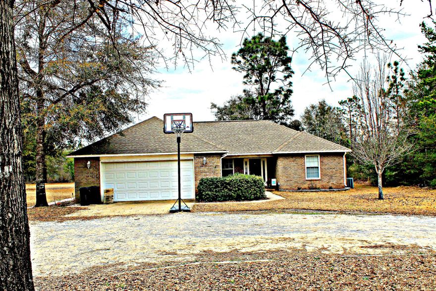 Beautiful Brick home on 1 acre with 2 car garage. The lot is completely cleared and irrigated by separate well. The interior of the home has new paint and flooring. The living room has cathedral ceiling and very open. The seller's have recently added a sunroom onto the house that includes an additional 200 square feet. Seller's will pay up to $5,000 in buyer closing costs with full price offer. All measurements must be verified by buyer.