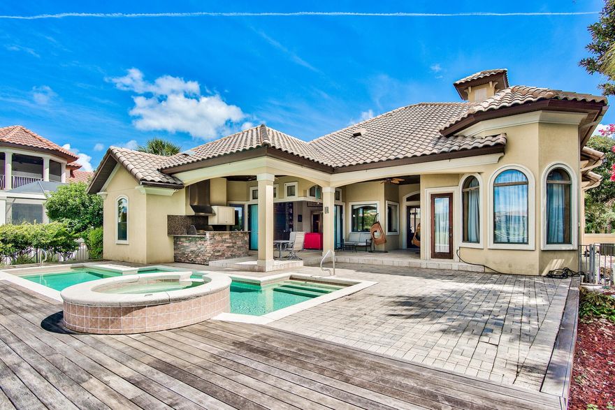 Rare find in Regatta Bay! All one level home with Lake and Golf course views! This home is perfect for entertaining! Very spacious outdoor living area with pool, hot tub, summer kitchen, and plenty of room for outdoor seating! Inside of the home you have a formal and informal living room, separate formal dining room, large kitchen with center island, a breakfast bar and a breakfast nook!
Other great features include, split floorplan, an office in addition to the 3 bedrooms, 3 full baths, plus a half bath. The two living areas and the master bedroom offer spectacular views of the pool, lake and golf course!