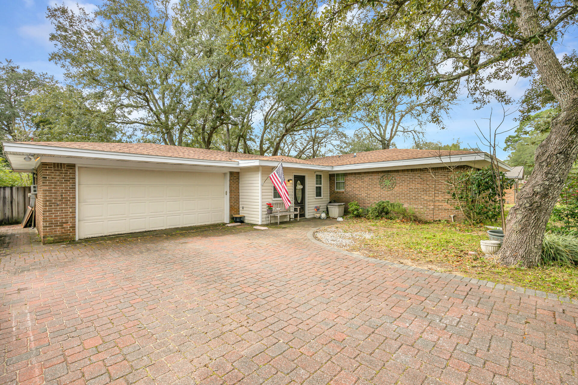 The Located in the HEART of Niceville. NEW ROOF! This 4-bedroom home rests underneath gorgeous patriarch oak trees and located just minutes from military bases, shopping, restaurants, schools and the gorgeous Emerald Coast beaches and bay. The home boasts an open living concept, a spacious kitchen gorgeous cabinetry, w/ endless countertops, wood burning fireplace + more! 2 sets of French doors open up to an oversized backyard w/ a shed and plenty of room for a pool. 2 Car Garage + large custom brick driveway + so much more! This is truly a home your friends and family will enjoy for a lifetime.