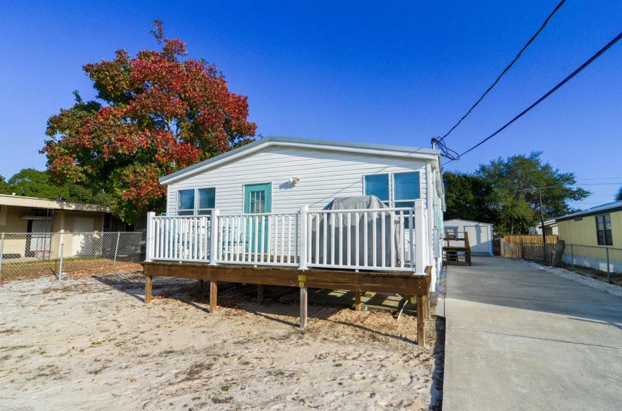 Wow! What a location! This home is only 2.5 blocks to Laguna Beach. Not only is this immaculate home close to the beach it is also being sold furnished. What a great opportunity! There are so many good attributes to property. The open floor plan and oversized living area are perfect for entertaining. The home also has a split floor plan, large deck to enjoy the gulf breezes and salt air, a terrific 50x120 lot, an oversized driveway perfect for friends and family, an outside shower, large shed and a completely fenced yard. My goodness! Incredibly this property is being sold completely furnished! This truly is a great investment opportunity. Whether it is for your beach getaway or used as a rental this is a wonderful property. So bring your swim suit and come join the Beach life!