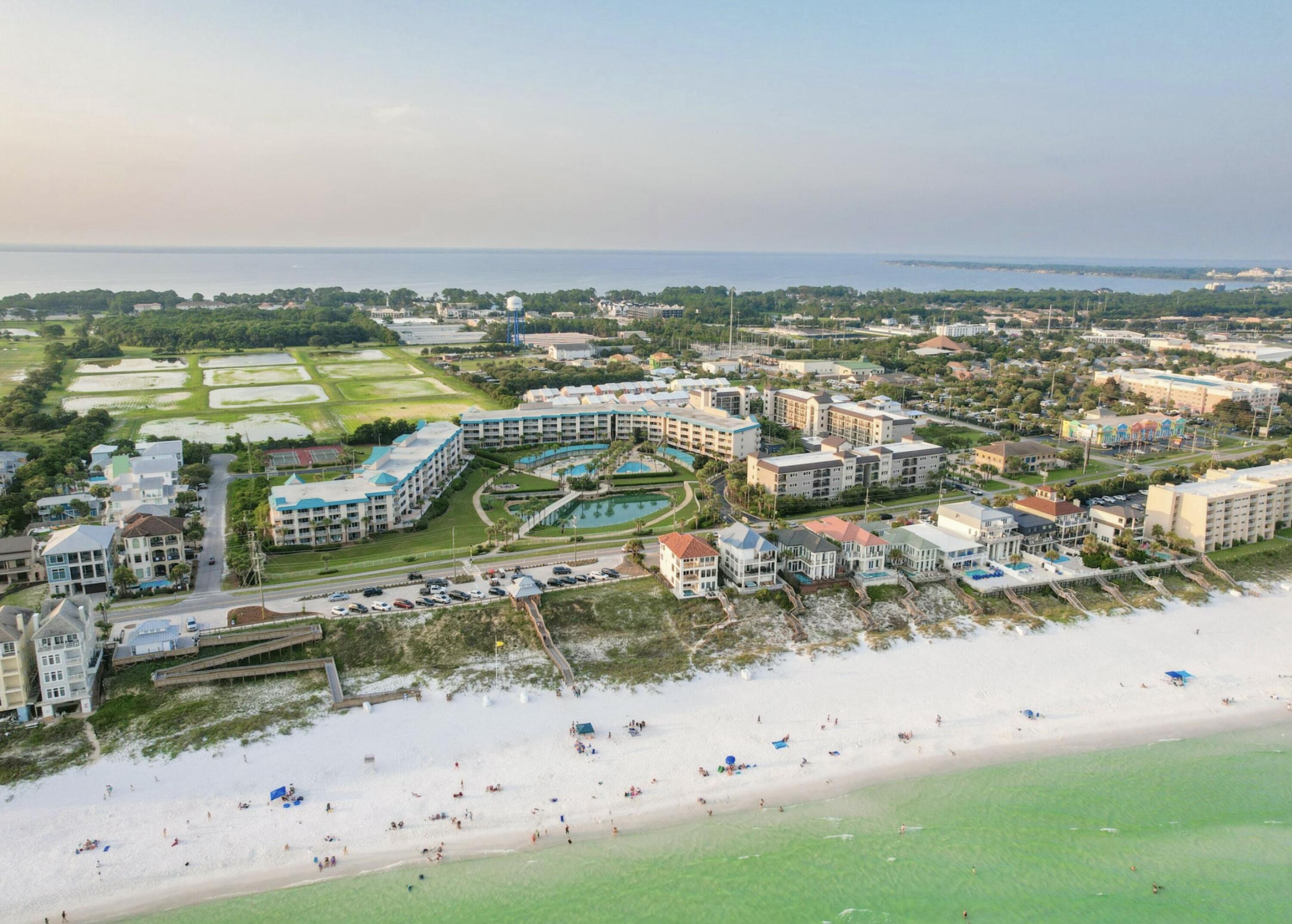 Your new beach home awaits at Amalfi Coast Resort. Lives more like a home this 2 bedroom with an enclosed bunk room is Southern facing with views of the Gulf. A private end unit grants extra natural light in the Gulf facing master suite. Large walk-in master bedroom closet, full size laundry room and a separate exterior storage cage means living large, unlike most beach condos. Second bedroom is oversized with two queen beds and the bunk room is outfitted with a daybed. Deeded garage parking space, locked storage cage. Sold fully furnished and rental ready. New beach access across the street with a ramp, parking, bathrooms, beach chair service and more. Resort-style amenities with two pools - one heated, fitness center, fire pit, two lighted tennis courts and fully fenced and gated.