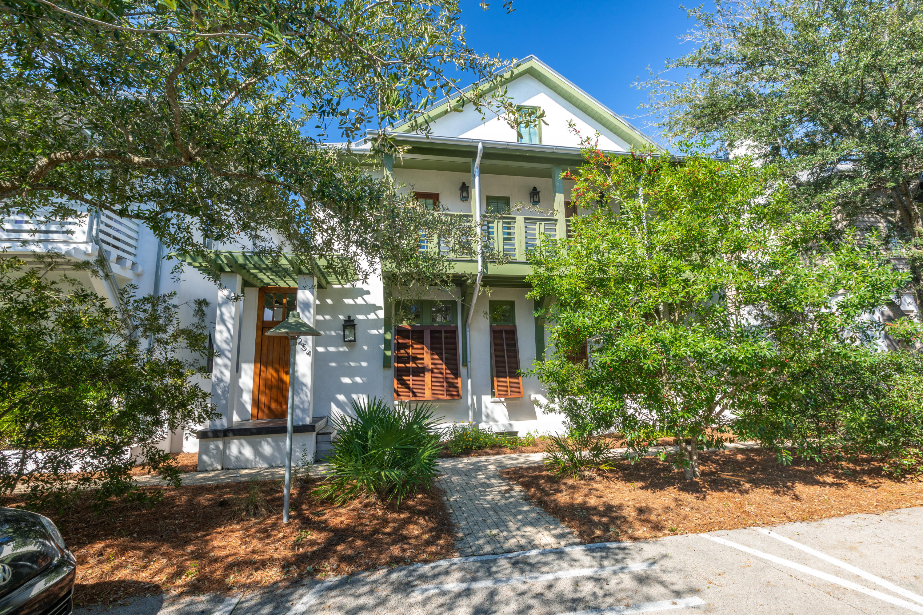 A must see Park Side  Rosemary Beach home with a spectacular courtyard offering a resort-like atmosphere. Ample seating and lounging areas surround an infinity hot tub and large pool with multiple waterfalls and lights. A porch swing, dining area, grilling area and beautiful landscaping enhance the courtyard atmosphere.  The main house features exposed wood beams, high ceilings, beautiful oak flooring, and an iPad compatible pool and spa system.  The expansive gourmet kitchen with granite countertops, top of the line GE Monogram, appliances, ice maker, beverage refrigerator, plentiful storage and adjoining dining area provide the perfect place for the chef to entertain. Relax in the living area featuring high coffered ceilings, built-in bookshelves and window benches.