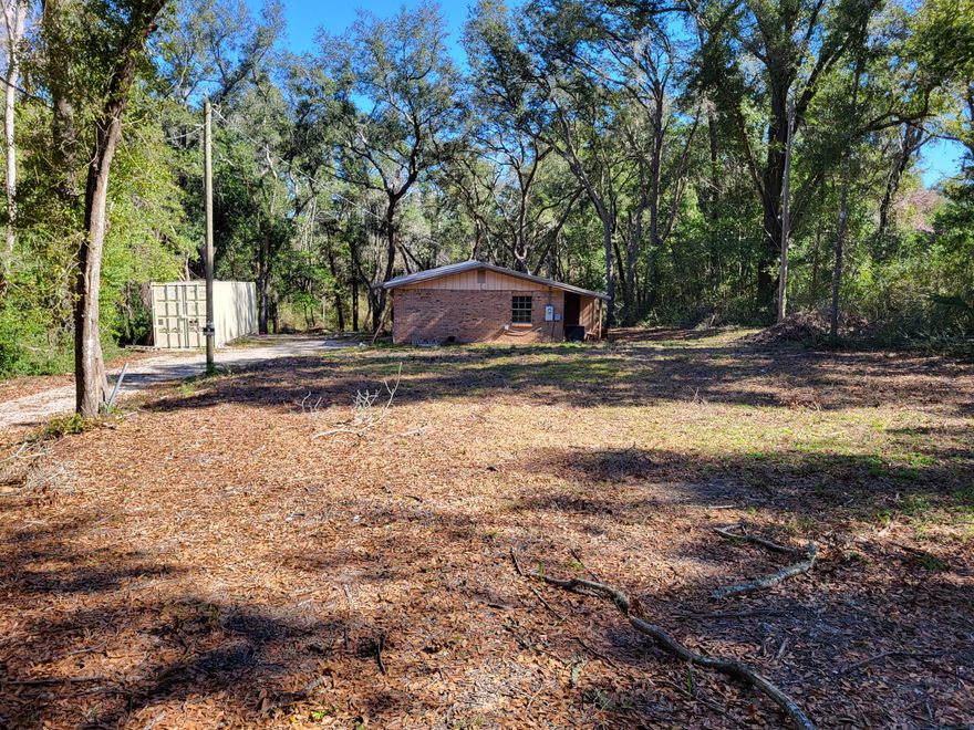 Large lot with 0.64 acres and small office building.  Has waiting area, break room, 2 private offices, and one restroom.  Zoned C-2 Commercial which allows outside storage.  Ideal for contractor, towing company, equipment company, pool company, etc.  Owner will seller finance with 20% down, over 20 years.  Will also consider leasing at $2,000 per month.