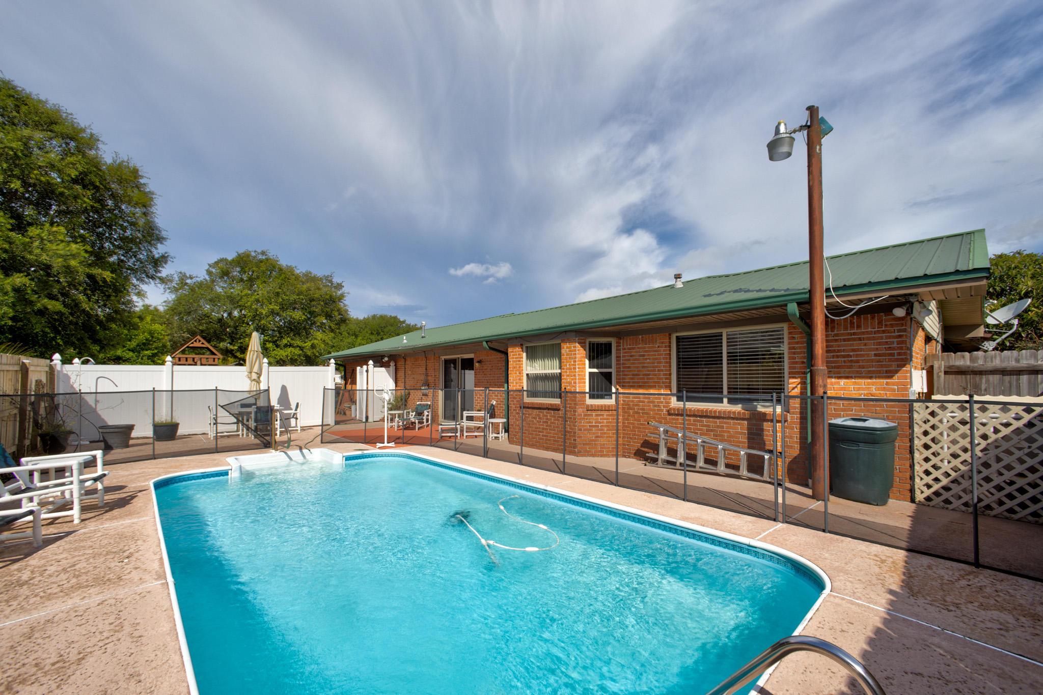 POOL TIME!!!! Come & see this wonderful family home & make it yours. So very well maintained. Updated wiring, metal roof, sprinkler system, play area & of coarse the gorgeous pool. Inside theres a delightful lay out. A bonus room is large enough to be made into a formal dining room or simply keep it as an office if desired.Close to great schools & shopping & minutes from Eglin AFB.