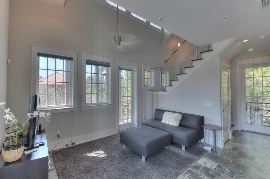 BUILD YOUR DREAM HOME ON ONE OF THE LARGEST LOTS IN ROSEMARY BEACH. The existing carriage house will allow you to stay and enjoy all that the community of Rosemary Beach has to offer while you are creating your family legacy. This beautifully designed carriage house has a full sized staircase leading up to the master bedroom which accommodates a king size bed for your comfort. The open floor plan boasts modern finishes such as elegant tile throughout and stainless steel appliances. There is plenty of storage and a two car parking garage below.