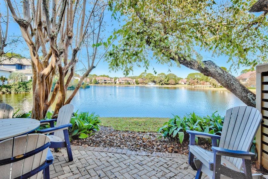 This two bedroom with loft plan is coveted in  Beachwalk Villas, but this one is even more so with a BONUS room, too! Let's start with the location-- sitting on the widest part of the lake with expansive views and located in a cul de sac in the part of the neighborhood that is nearest to the beach. This two story townhome has an upstairs and a downstairs master bedroom, a loft area with a sleeper sofa and a bonus room with two twins beds.  Both bathrooms have recently been renovated with the coastal look of  subway tile and turquoise glass tile accents.  Beautifully decorated throughout, this home conveys with all of the quality furnishings and everything you see as you walk through, making it  ready for you and your family to use a permanent residence, a second home or