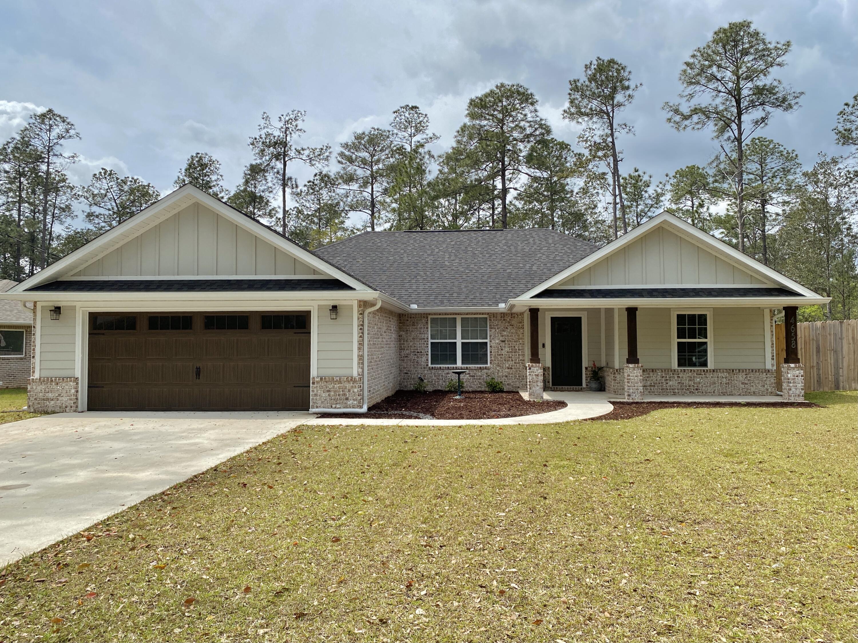 4 bedroom 2 bath home on a half acre lot. This home features a large front porch, and back deck to take advantage of the quiet neighborhood.  Quality, attention to detail and upgraded features throughout. Open floor plan with a magnificent Kitchen that features custom cabinetry, granite counter tops, stainless steel appliances and an island. The large master bedroom has a trayed ceiling that steps up from 9' to 10'. The master bathroom has double vanities, a big soaker tub, large marble shower and a large walk in closet.