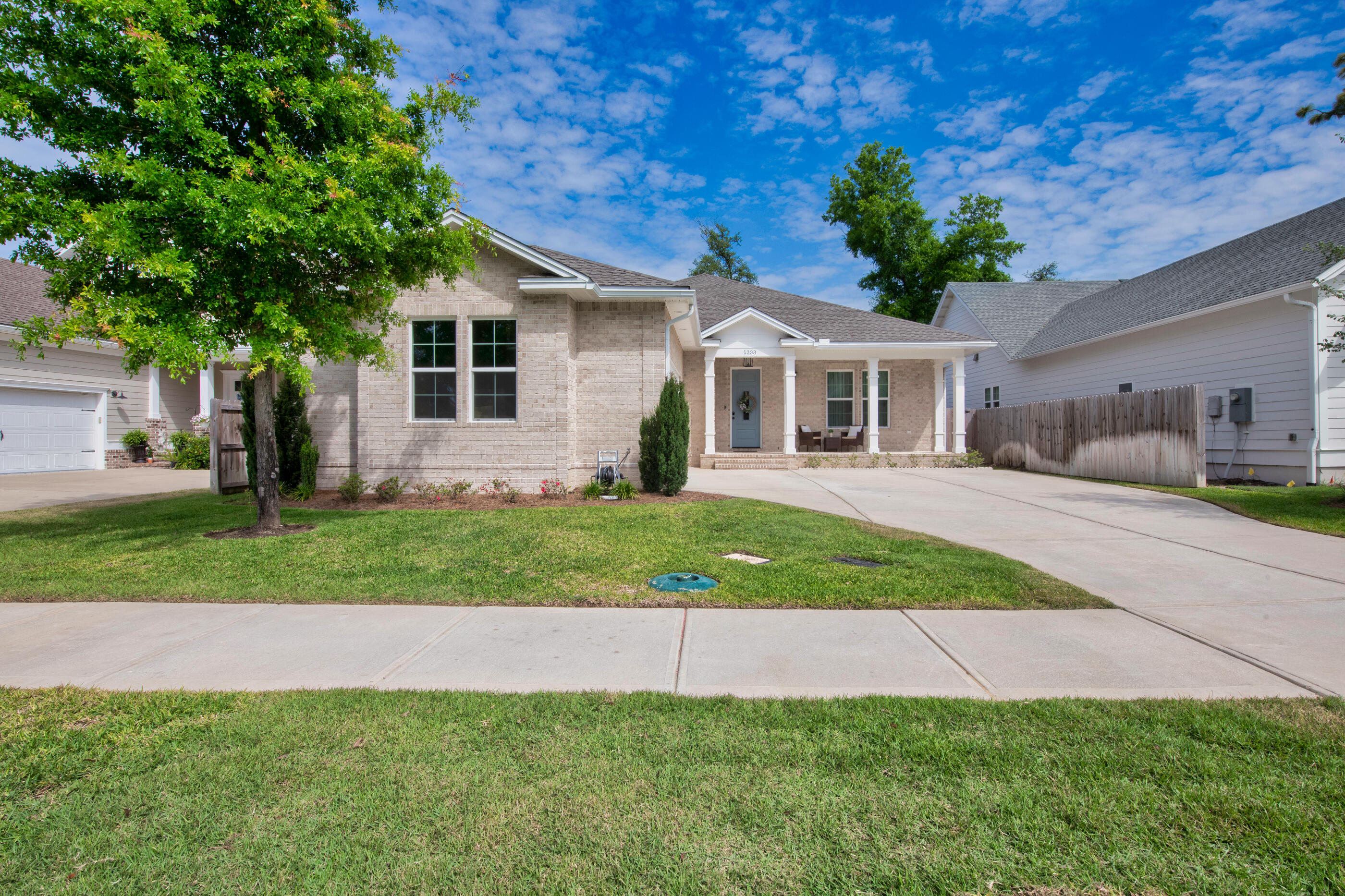 Offering an assumable VA loan at a 4.75% interest rate; this home offers plenty of space, with each bedroom having its own private bathroom and generous size. There's also a convenient half bath for guests.The open kitchen flows into the dining and living areas, featuring a large walk-in pantry, gas range, and a separate bar area with a built-in wine cooler. Quartz countertops, semi-custom cabinets, and a custom backsplash give the space a warm, inviting feel.The primary bedroom is spacious, including a large walk-in closet, extra storage, and an ensuite bathroom with a rain shower and double vanities. The home also includes a dedicated laundry room with a folding area for added convenience.
