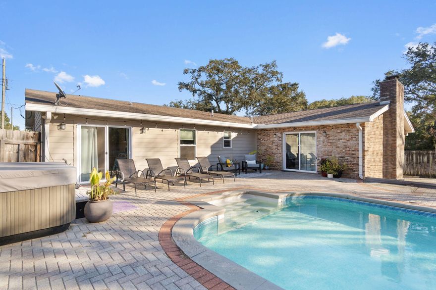 PRICE REDUCED!!Welcome to the highly sought-after Kenwood golf course neighborhood. Only three blocks away from Kenwood Elementary, the golf and pickleball courts.  Enjoy your summers next to the pool or the winters by the brick fireplace in this gorgeous home. The house was completely updated in 2019 featuring 'Kraftmaid' cabinets and mosaic backsplash. The Master bathroom features a big soaking tub and a walk-in shower in the master. Delight in this open-concept living space. Updates include:2019 Roof2019 Windows/ Sliding Doors2019 Pool Liner2022 AC unit2022 Tankless Water Heater 2022 Point of Use Water Heater2023 Pool PumpUpdated Light  Fixtures Granite Countertops 5K in seller concessions for a full price offer3% assumable VA available