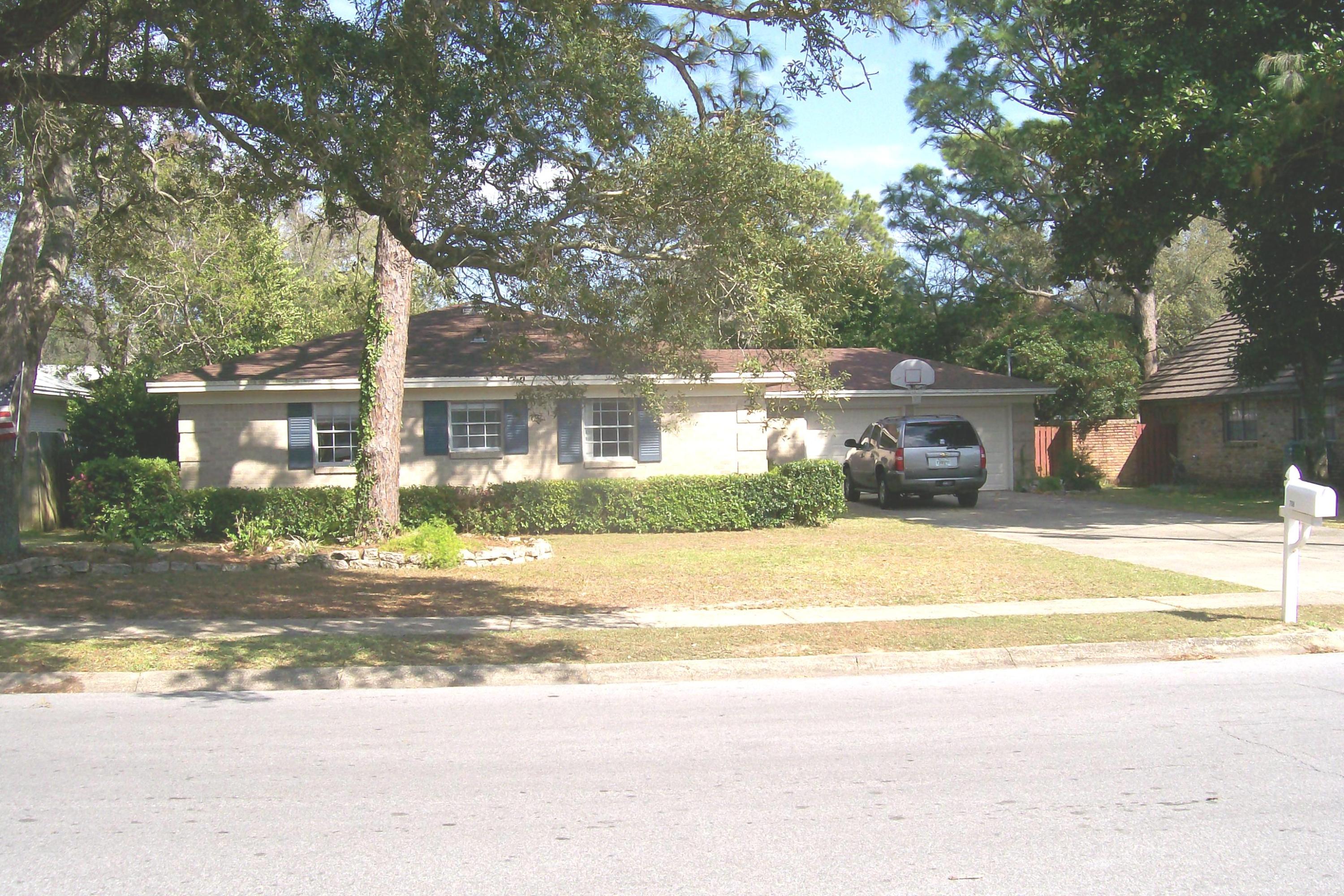 This brick home offers a lifestyle experience you and your family will enjoy together. Come see this charming home with its updated bamboo hardwood flooring, easy flowing open floor plan and updated kitchen. The kitchen is the showstopper with its open concept and tons of cabinet and counter space. There is a breakfast bar and a smooth top stove. The kitchen flooring is laminate tile. The stainless steel refrigerator is negotiable, also the unique light fixture in the dining room. When you walk in the front door, experience the exceptional openness and easy flow from the foyer, dining room, living room, breakfast nook and kitchen. Don't miss the spectacular bookcase between the foyer and the living roomit's negotiable. The bedroom wing has a spacious entry hall.The master bedroom and