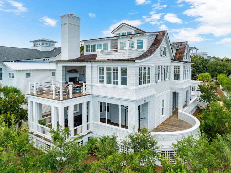 Introducing 109 Gulf Bridge, a prestigious home overlooking Camp Creek Coastal Dune Lake and the Gulf of Mexico beyond. Situated on a generous corner lot in Watersound Peninsula, it offers unparalleled views and expert craftsmanship with thoughtful details, plus easy beach-access + amenities. Entering through the courtyard, find a newly added pool and astroturf landscaping that leads to a large front porch complete with outdoor shower. Inside on the first floor, enjoy 3 guest rooms with ensuite bathrooms, alongside a thoughtfully designed laundry room, second living area, and back porch that's fashioned into an outdoor workout room. Upstairs, enjoy picturesque views from nearly every direction. A living room  complete with soaring ceilings, grand fireplace and built-in window seats and bookshelves  opens to a newly updated chef's kitchen, sunny sitting room, and large porch. Off the kitchen, find a dining room with its own coastal dune lake views. Down the hall, enter the primary suite, which features two separate closets and a beautiful ensuite bathroom with walk-in shower, water closet, dual vanities, and spa-like tub. 

On the third floor, enjoy bird's eye views from a built-in office space, flex space, and balcony. 

Craftsmanship and luxury detailing prevails across all three stories, with ample woodworking details and designer finishes that complement the quintessential Watersound Beach styling. With a dumbwaiter, built-in storage, multiple living spaces, one-car garage, driveway parking for multiple vehicles, back-door access to a lakefront trail, and unobstructed views, 109 Gulf Bridge is a unique opportunity and must-see. 