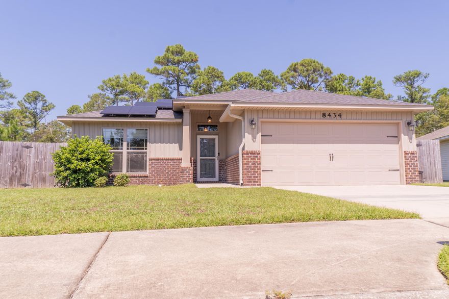 This 3-bedroom, 2-bath home in Navarre offers the perfect blend of comfort and convenience. Just a short drive to beach; central to shops and restaurants. As you step inside, the open living area boasts vaulted ceilings, creating a bright and inviting space. The kitchen and bathrooms both have granite countertops and title, the kitchen having an added backsplash. With no neighbors in front or behind it makes the back patio and yard a great place for outdoor relaxation!