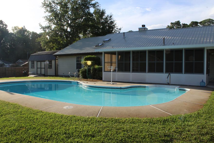 Welcome Home!   This well-maintained 3 bed/ 2 bath home in Mary Esther is located in the Quail Run subdivision. This home is approx. 3.4 miles west of Hurlburt Field Air Force Base. Convenient to Fort Walton Beach and Navarre's beautiful beaches! It is a beautiful large corner lot with mature landscaping in both the front and back yards complete with an in-ground salt water pool and a sprinkler system to keep landscaping growing nicely. In the huge backyard you will find a handy man's workshop and if gardening is your thing it is equip with your very own greenhouse! There is a nice enclosed air-conditioned porch perfect for your enjoyment no matter what the season! The fireplace in the living room is cozy and its gas, no need for wood!