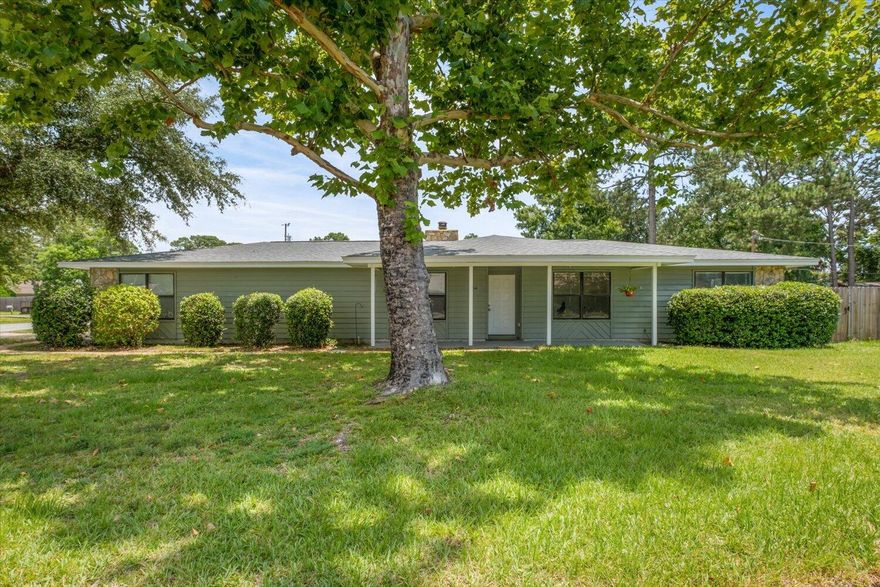 Here's your chance! Own a great home only minutes away from Hurlburt AFB or a 15min drive to the Beach! The home is situated on a large corner lot with sidewalks and a nice welcoming front porch. As you enter you will notice the beautiful laminate wood floors throughout the main living area and kitchen. There is an abundance of natural light throughout, stone fireplace, Vaulted ceilings, neutral grey tones for a light and bright feel. The kitchen features stainless appliances, tile backsplash, pantry & window above the kitchen sink. The back yard is fully fenced with a very large side yard for all your outdoor activities. New Roof in 2022 and Brand New Water Heater.