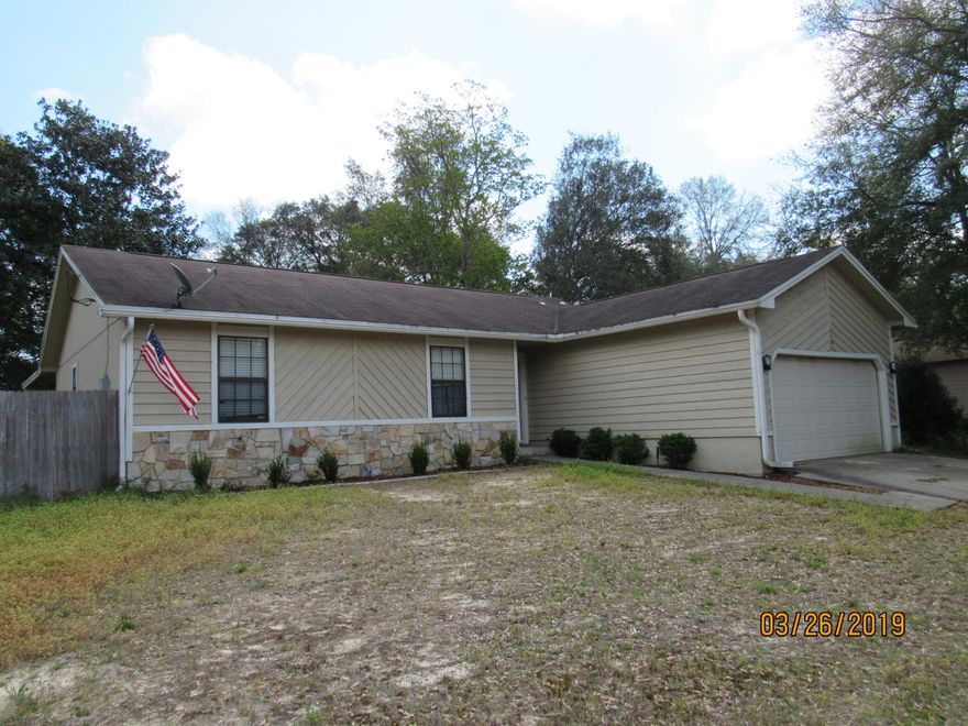 This charming, 4 bedroom, 2 bath home is centrally located in the heart of Niceville & features vaulted ceilings, fresh paint, as well as upgraded flooring and lighting. The spacious living room is open to the dining room and to the upgraded kitchen, which boasts newer appliances, a flat cooktop stove, granite counter tops, breakfast bar, and a pantry. The master bedroom will easily accommodate king-size furniture and has its own walk-in closet and full bath. Each of the three guest rooms are spacious, and one has its own massive walk-in closet. There is a full guest bath as well. There is a 2-car garage, a screened in porch, and a covered patio out back, with a partially privacy-fenced yard for quiet enjoyment. Pets may be considered on a case-by-case basis with owner approval. No smoking