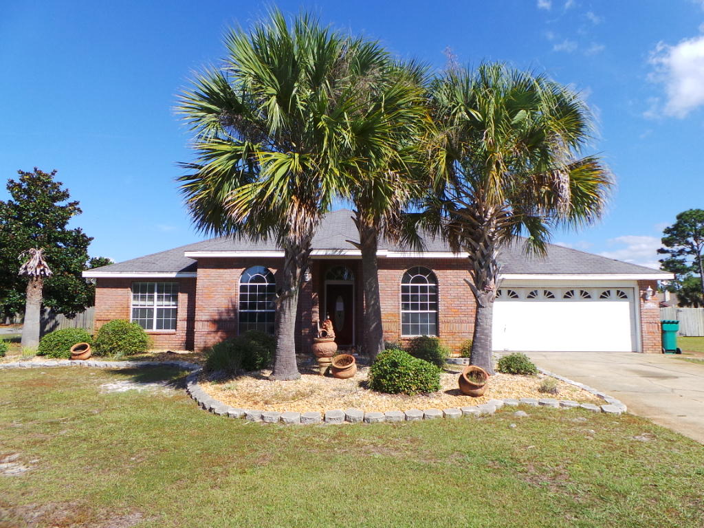 Beautiful Home in Holley By The Sea! This custom built home features over 2200sqft of functional floor plan, high ceilings, gorgeous wood laminate flooring, four spacious bedrooms and two full bathrooms. Kitchen boasts double ovens, stove top, stainless steel dishwasher and dine-in area. Formal dining room is adjacent to the home office/study both with stunning arched windows to let in natural light. Living room has wood burning fireplace and recessed lighting. From the living room out the double doors is a huge family room/recreation room/sun room with cathedral ceilings and an immense amount of light, this room could possibly be your personal green house! This bonus room looks out to the in-ground pool and nicely landscaped backyard.