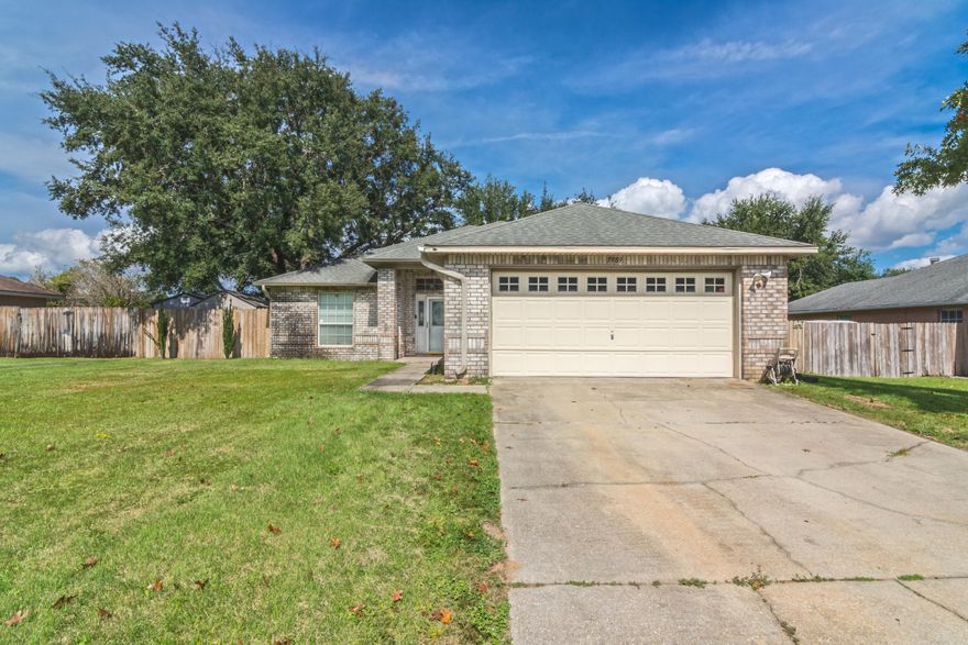 Nice home in very quiet, centrally located neighborhood which has its own community Bay access complete with a fishing dock!  12 foot ceilings and bullnose corners greet you upon entry. Home features full brick exterior, split floorplan with vaulted ceilings in living room, stainless fridge and dishwasher, fireplace, and bay window in the open eat-in kitchen. Master has trey ceiling, walk-in shower and whirlpool tub.  Large screened back porch with double ceiling fans and firepit in the fenced in yard. Upgrades include keyless entry, glass screen door, Neighborhood has Underground utilities. New Roof with acceptable offer.  HVAC 2011, Water heater 2016.