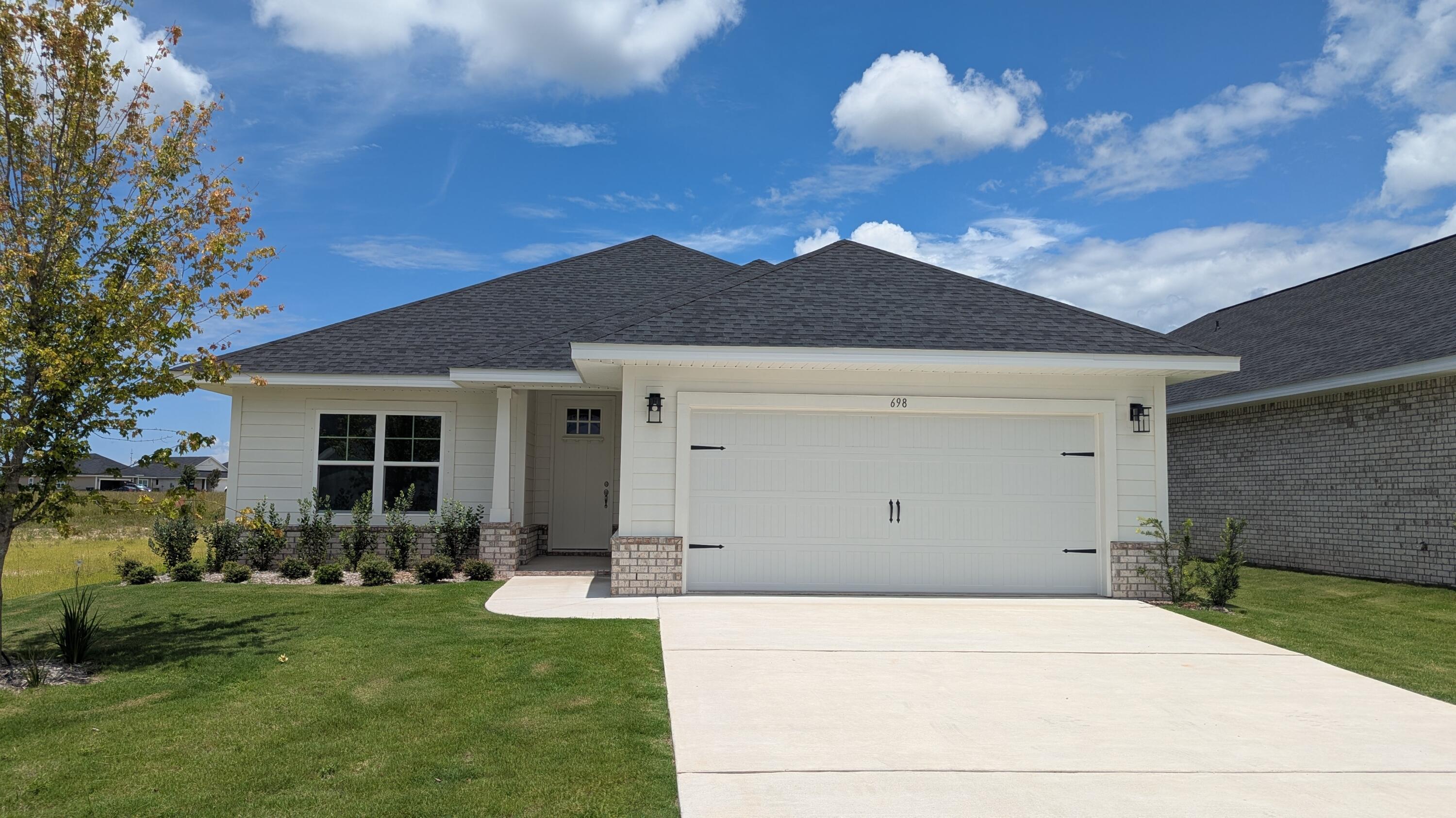 Seller pays the bulk of closing costs w/ preferred lender. 4.99% fixed rate financing (FHA&VA) $10K flex money which can be used at buyer's discretion to add features such as blinds, fridge, additional ceiling fans or apply to prepaids, HOA costs or other closing costs, etc.Popular Craftsman 3 BR/2 BA home with Hardiboard siding and brick skirt. White exterior, spacious master bedroom (14x22), 9' ceilings throughout, 8' entry doors, quartz countertops in kitchen and baths, durable Coretec Pro Plus LVP flooring throughout. No carpet. Tray ceiling in master with a large walk in closet, separate tub and shower. Generous covered patio. Fully sodded yard, sprinkler system, well+pump. Garage opener, self-close cabinet doors+drawers. Community pool to be built by develop