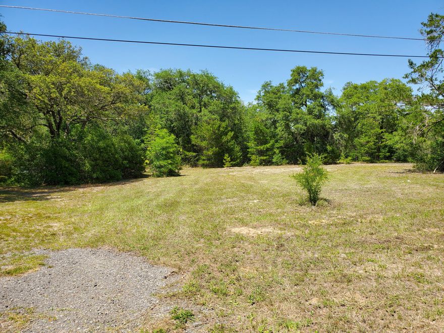 Potentially could go Commercial with estimated traffic count per day 5400.  Great Investment.  Tap Fee Paid. Boundary Survey Available.  Electricity at road.  Buyer is responsible to verify utilities, lot size and land usage.
