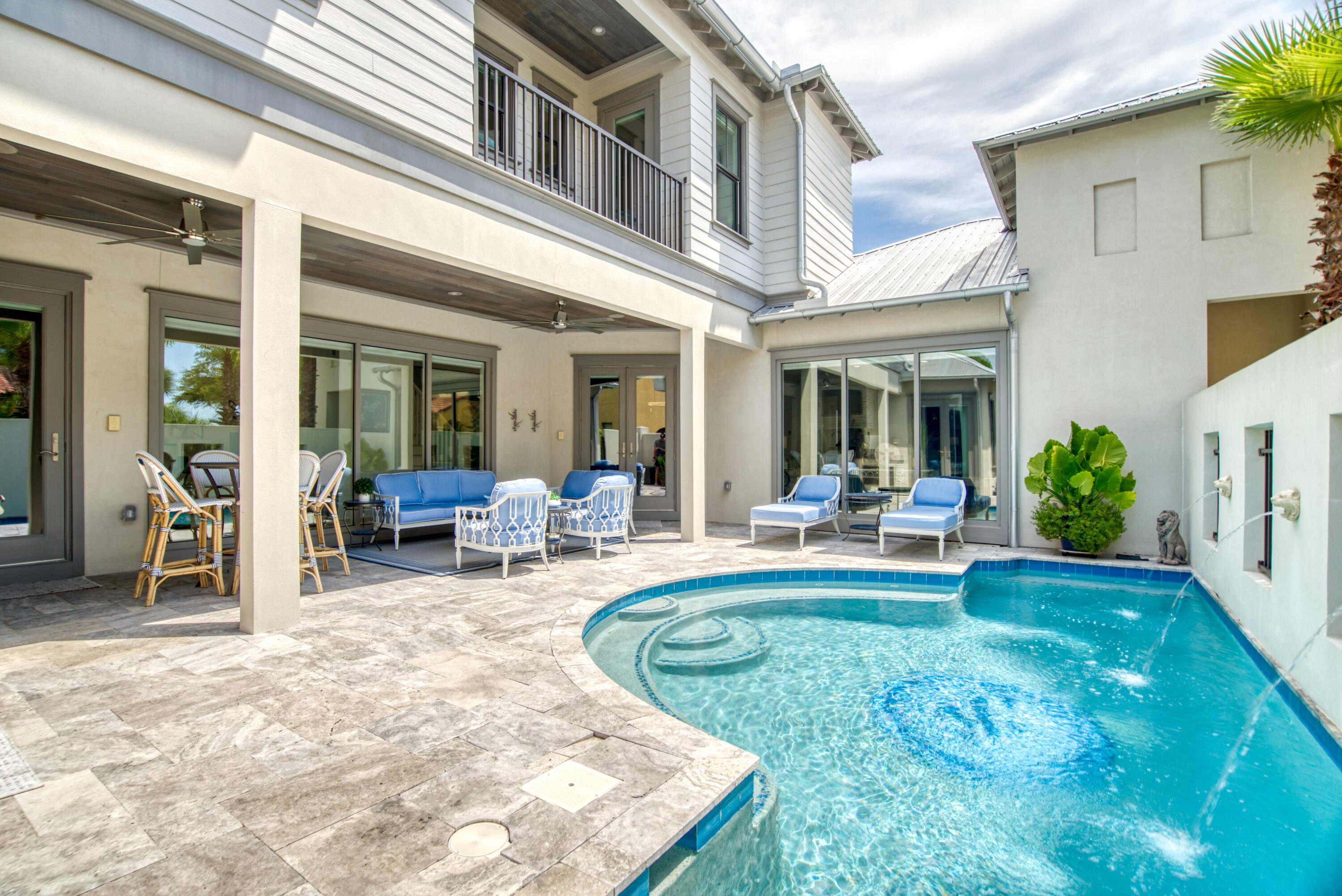 Welcome to 252 N Saint Francis! The home is located in the highly desirable, private gated community of Emerald Waters Village. This home is every entertainers dream, boasting a spacious first floor open floor plan. Upon entering the home your eyes will instantly be drawn to the floor-to-ceiling windows which overlook the outdoor summer kitchen and oversize private pool. The kitchen features an oversized kitchen island, the perfect place to gather around is the perfect place to gather around, quartz counter tops, burnt wood cabinetry, and top-of-the-line Thermadore appliances.