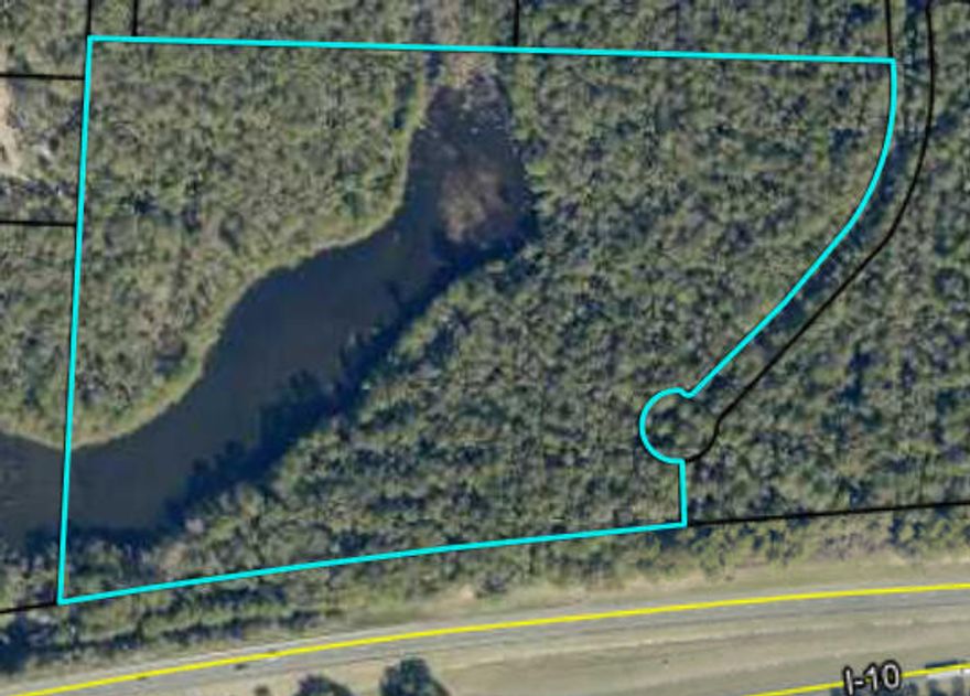 This expansive 19.44 acre property in Okaloosa County offers incredible potential for development, investment, or personal use. With a large pond, this tract of land provides fishing at your fingertips. Situated just a short drive from the heart of Crestview, I-10 and Eglin Air Force Base, this location is ideal for those seeking convenience and accessibility. The combination of a large land area makes this a rate opportunity that won't last long.