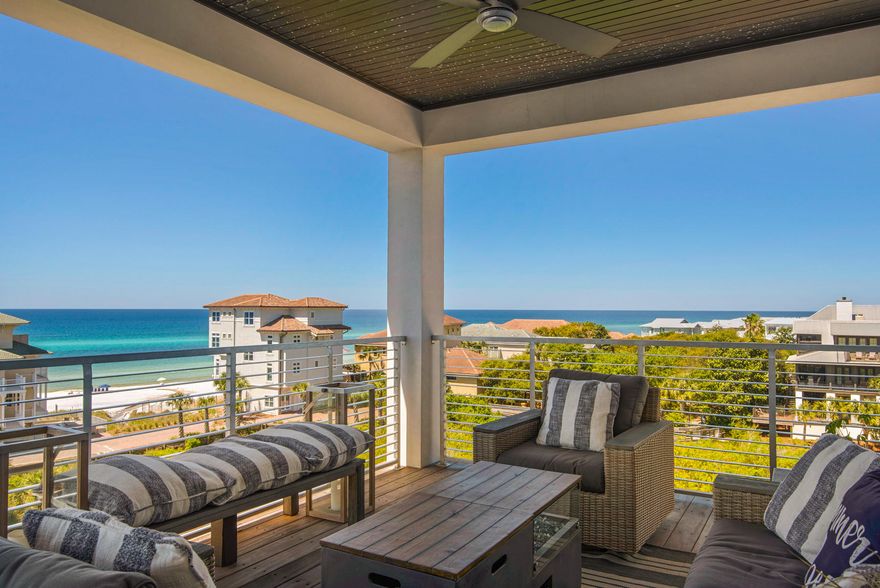 MOTIVATED w/Price reduction and willing to trade! Open concept, light & airy home with warm coastal elegance at its finest. This beach home has gulf views, a neighborhood pool & steps to the beach. 4 story professionally furnished & decorated this 5 bedroom 7 bath home has multiple gulf views, two car garage & unlimited coastal character. There is numerous unique features including raised X beam ceilings, hardwood, tile and concrete floors, spacious bathrooms with luxurious walk-in showers, barn doors, an elevator & oversized glass doors that bring the outside in. The kitchen has a six burner gas cooktop, double oven, custom trimmed refrigerator, large pantry, drawer microwave, quartz countertops & an island that seats 6. The dinning room seats 12 & is open to the kitchen & living roo
