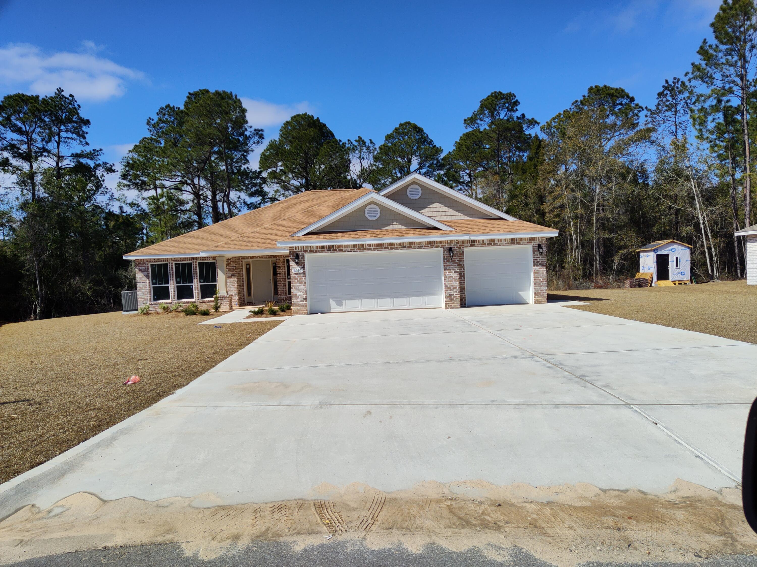NEW BUILD IN THE PRESERVE IN MILTON! -Wide open floor plan with 10 foot ceilings-stainless steel appliances and granite counter tops in kitchen-covered front porch and lanai-large master suite with dual vanities, garden tub and separate shower-ceiling fans -low E tilt in windows for easy cleaning--sodded front, side and back yards with sprinkler system featuring Rain Bird sensor and automatic timer-half acre lot. The Preserve is convenient to I10, less than 30 minutes to Navarre Beaches, downtown Pensacola and the Cordova Mall. All lots in The Preserve are on public water and sewer, NO SEPTIC TANKS, and there is plenty of room in the back yard to put a pool, shed or workshop or to store your RV, boat and other toys. Come by our model @ 4994 Red oak Drive Milton FL in The Preserve