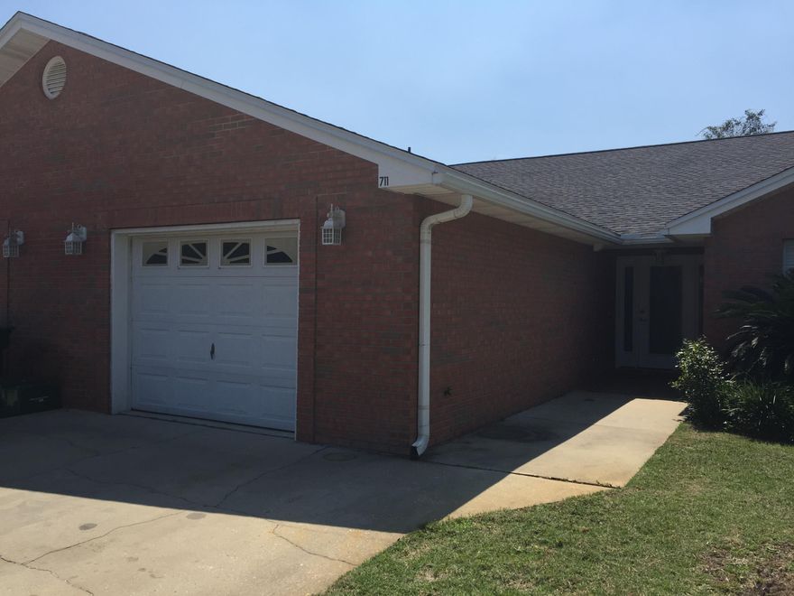 Single story townhome with granite counters and large back yard.