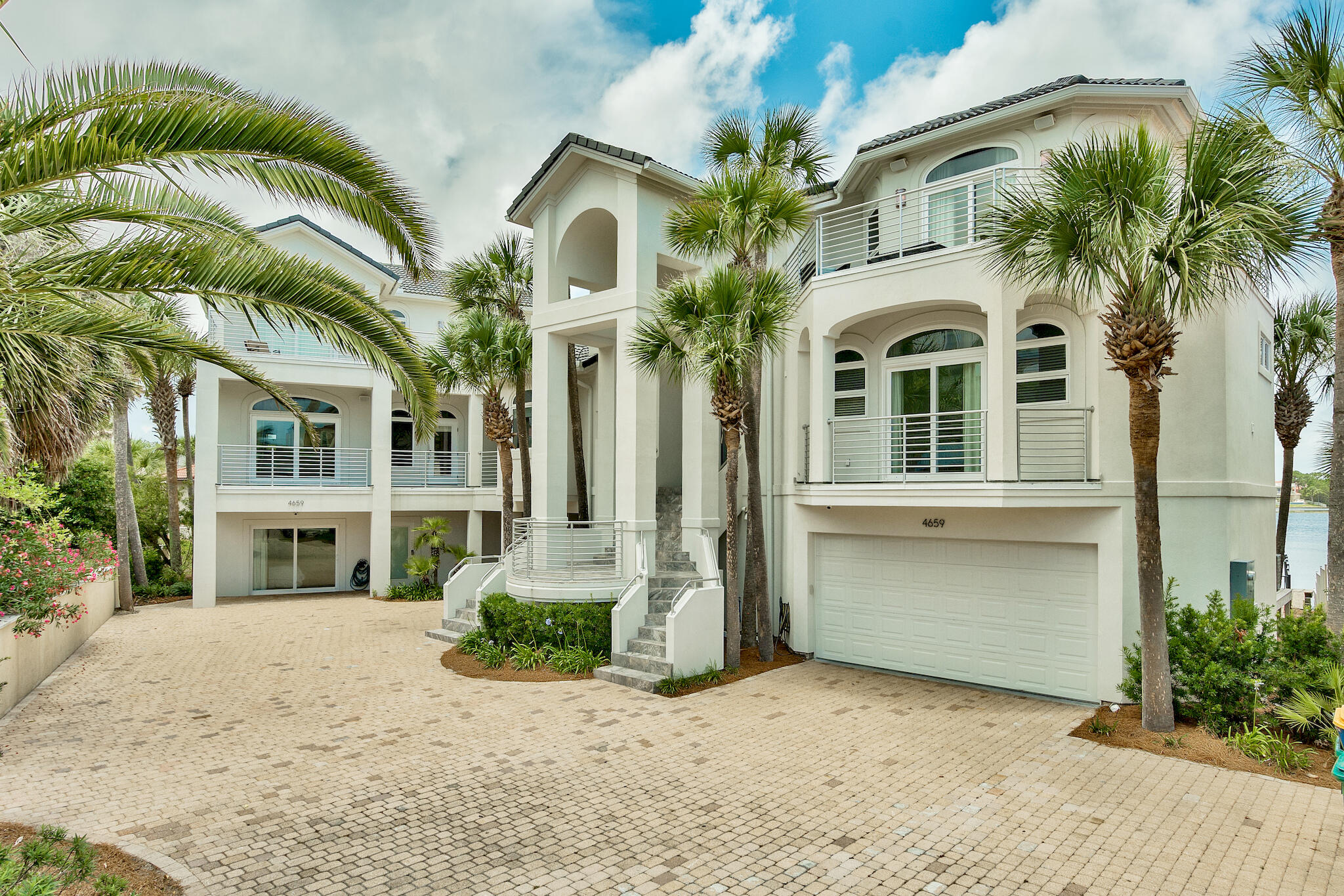 Huge Price Improvement! The White Pearl boasts over 7,041 of luxury Destin living. Two beautifully furnished great houses interconnected by seamless breezeways and 180-degree gulf views. This Lakeside estate rest 80 ft on Four Prong Lake in the gated community of Destiny Way. Striking private tiled infinity pool with jacuzzi, summer kitchen, BBQ grill, freestanding full bath, and more.  Experience the golf cart community with tennis courts, fitness center and recreation areas. The White Pearl is ideal for a large extended family or Investor pursuing a short-term rental cash flow property. Delight in three stories of luxurious living, eleven stately bedrooms & twelve impressive bathrooms.  Steps away from the Gulf of Mexico and white sandy beaches. Schedule your private showing today!! Public beach access directly across the street from Destiny Way.
Please see all documents in report.
Pool has a swim up bar with waterfall feature. Complete indoor and outdoor audio entertainment sound system. 