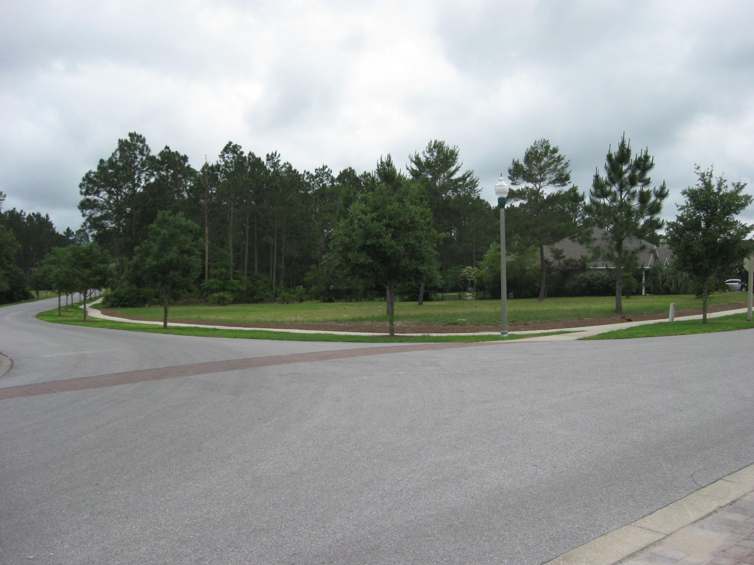 JUST REDUCED in Gated Golf Course Community of Windswept Estates! Don't Miss Out on this Opportunity to Build Your''Dream Home'' on this PRIME Corner Lot located directly across from Golf Clubhouse & Pool. Lot Cleared,Sodded & Sidewalk in place. Walk to ALL Amenities offered to the Community. Enjoy Windswept Dunes Golf Course, a 5-Star Championship course ranked ''Top Ten'' by Golf Magazine upon opening. Located just outside of Freeport & minutes from the white sand Beaches on the Emerald Coast & the NW Florida Beaches Int'l Airport. Approx 20-30 minutes or so to Excellent Shopping & Dining in either Destin or Panama City Beach. DON'T MISS OUT on this awesome opportunity to Own a Prime Lot in the serene beauty of this quiet & peaceful Subdivision!