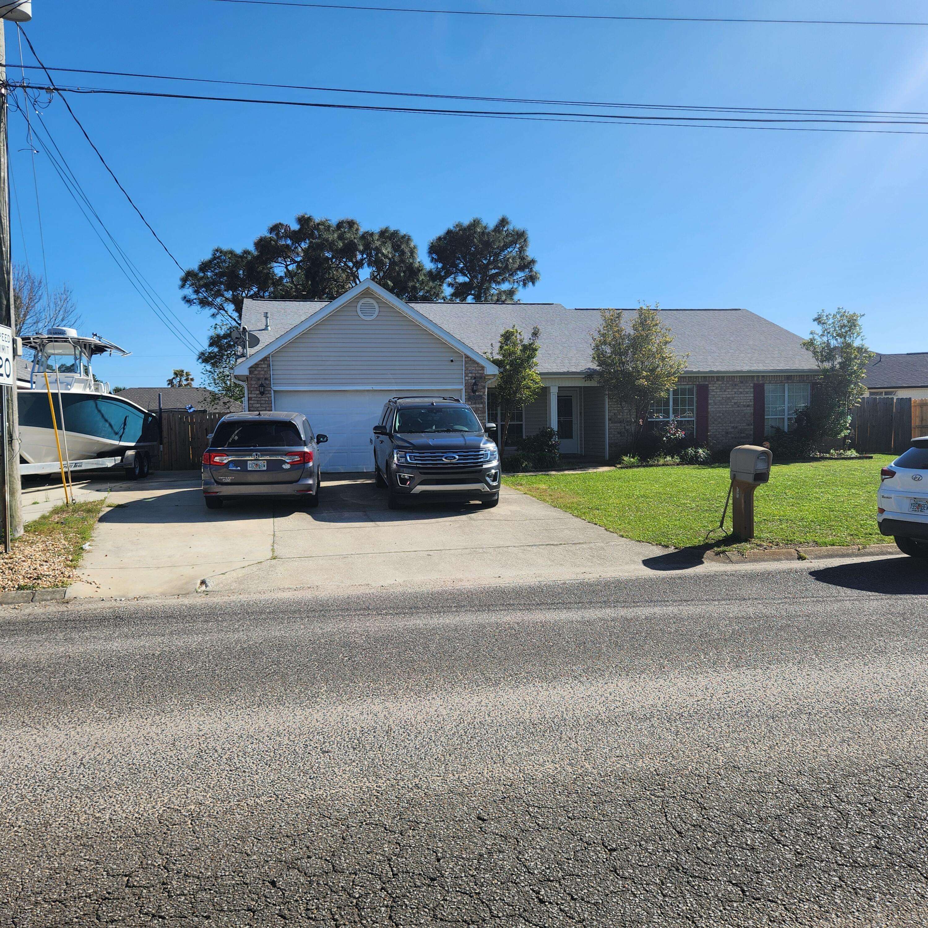 * This home has solar panels, and ELECTRIC IS INCLUDED UP TO $200.00. Less than 3 miles to the Navarre Beach and just minutes to Hurlburt Field, this 4 bedroom 2 bath home is waiting for you! Open great room featuring 10 foot ceilings, and a wood burning fireplace. Large eat-in kitchen with breakfast bar, and walk-in pantry. The master suite features a walk-in closet and a master bath with garden tub, separate shower and full size double vanity. Covered patio in the fenced back yard. 2 car garage and extra parking pad to left of driveway. Small dogs 20 lb. or less with additional Pet Fee and Pet Deposit. NO SMOKING ON PREMISES All tenants are enrolled in our Residents Benefit Package for $50.00 a month which includes Air Filters, Tenant Insurance, On Demand Pest Control and more.